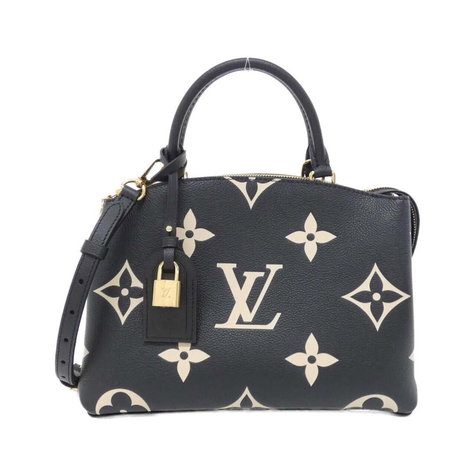 Louis Vuitton Handbag Leather: Louis Vuitton Handbag Leather Calfskin leather construction gives this Louis Vuitton handbag its distinctive look and feel. Measuring 21cm x 29cm x 12cm, it features a classic design with clean lines