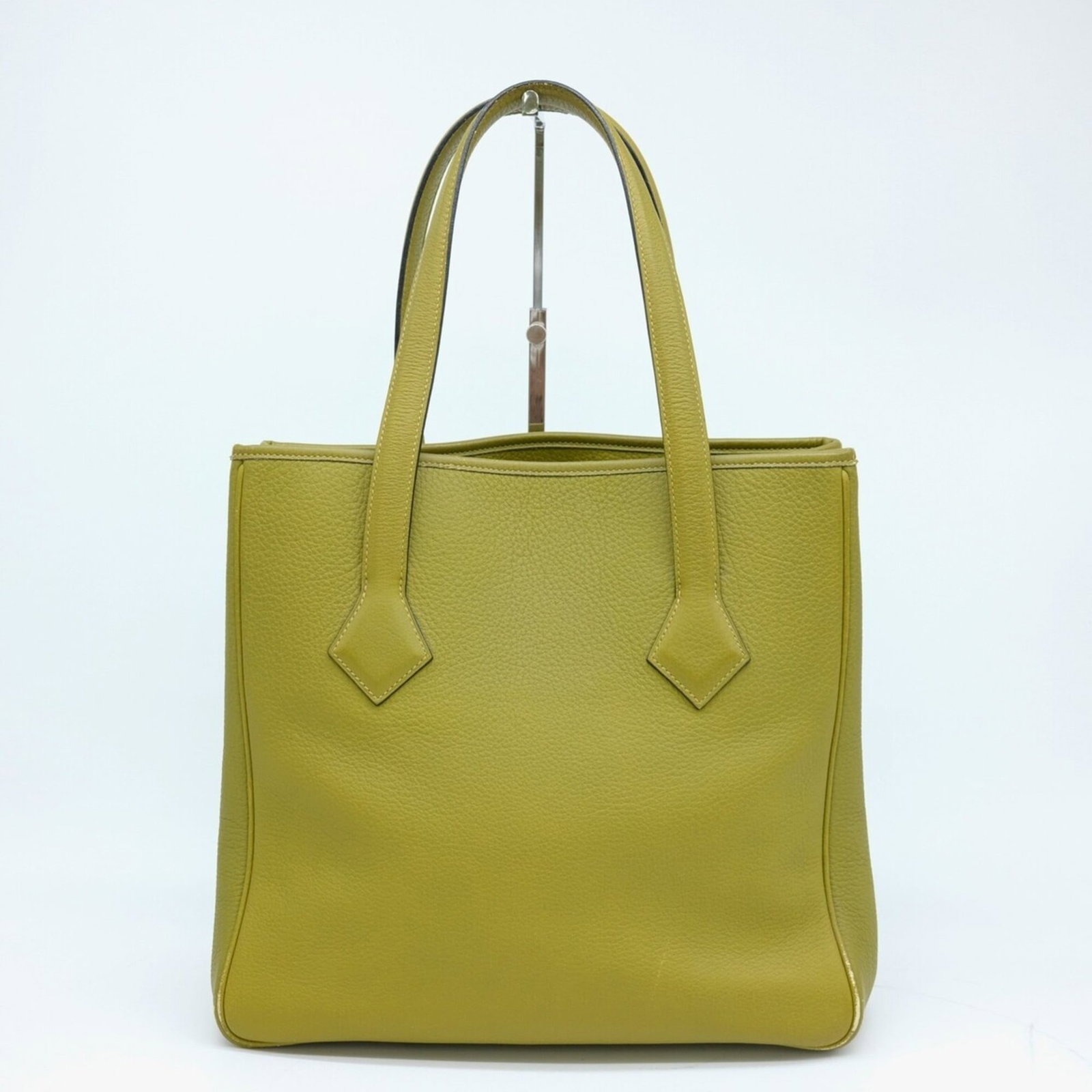 Tote Bag Taurillon Clemence Leather Hermes: Tote Bag Taurillon Clemence Leather Hermes Taurillon clemence leather tote bag from Hermes, available in anis green. This stylish and compact bag measures 30cm x 32cm x 14cm, making it a practical cho
