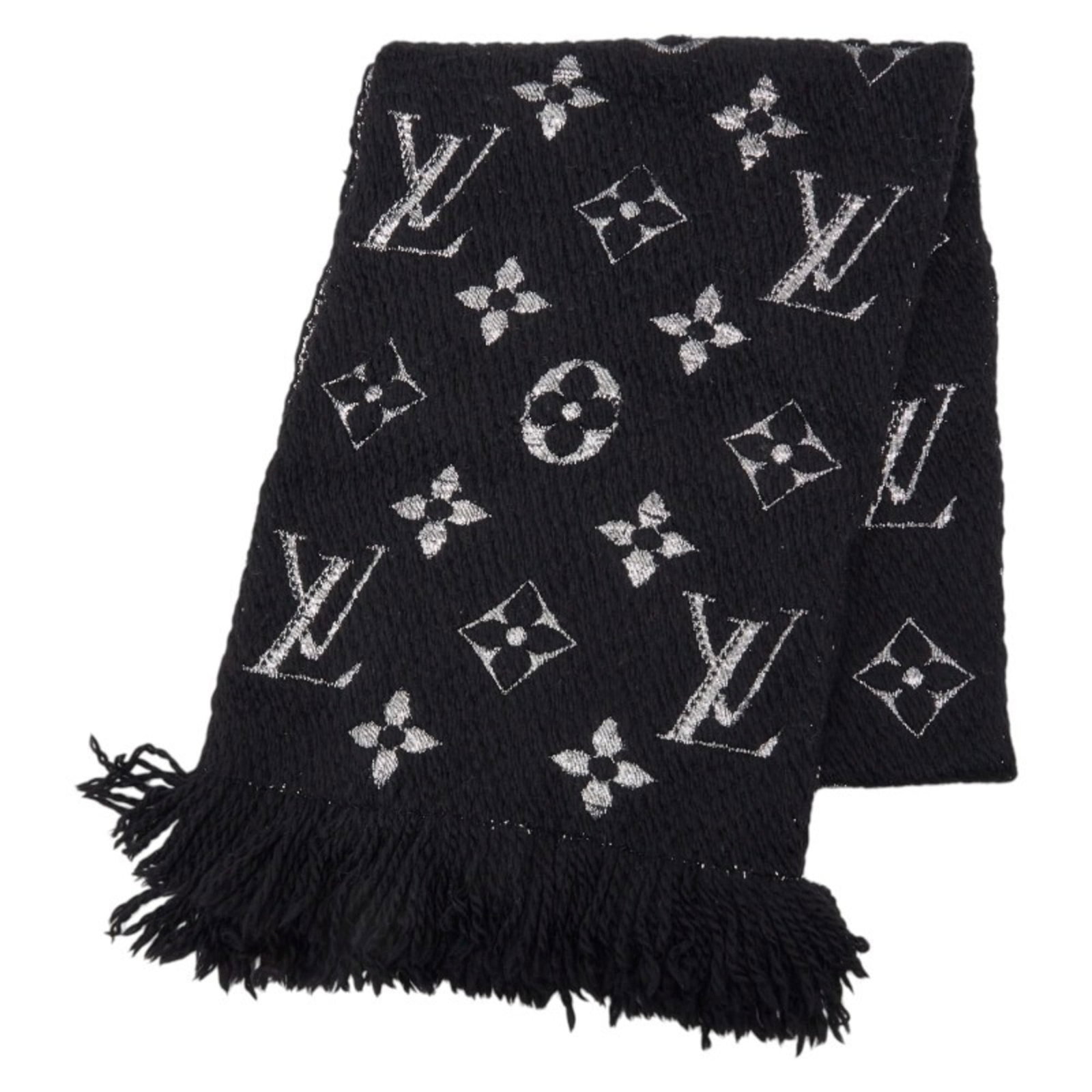 Silk stole by Louis Vuitton: Silk stole by Louis Vuitton Silk stole by Louis Vuitton, featuring a striking black color and elegant dimensions of 1.65m x 27.5cm, adds a touch of sophistication to any outfit. Made from a luxurious
