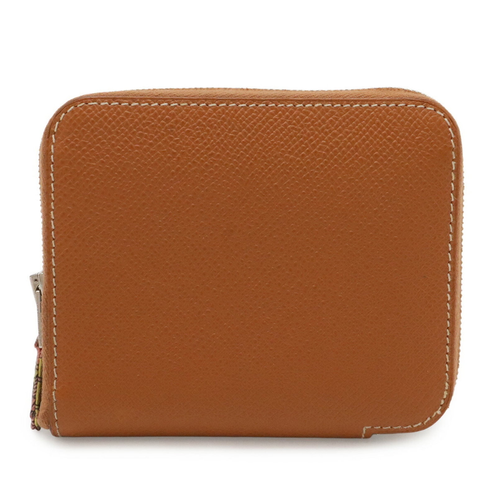 Epsom silk leather coin purse case Hermes: Epsom silk leather coin purse case Hermes Epsom silk leather coin purse case from Hermes, crafted in France with Epsom leather and adorned with silk. The Cognac color adds a touch of sophistication