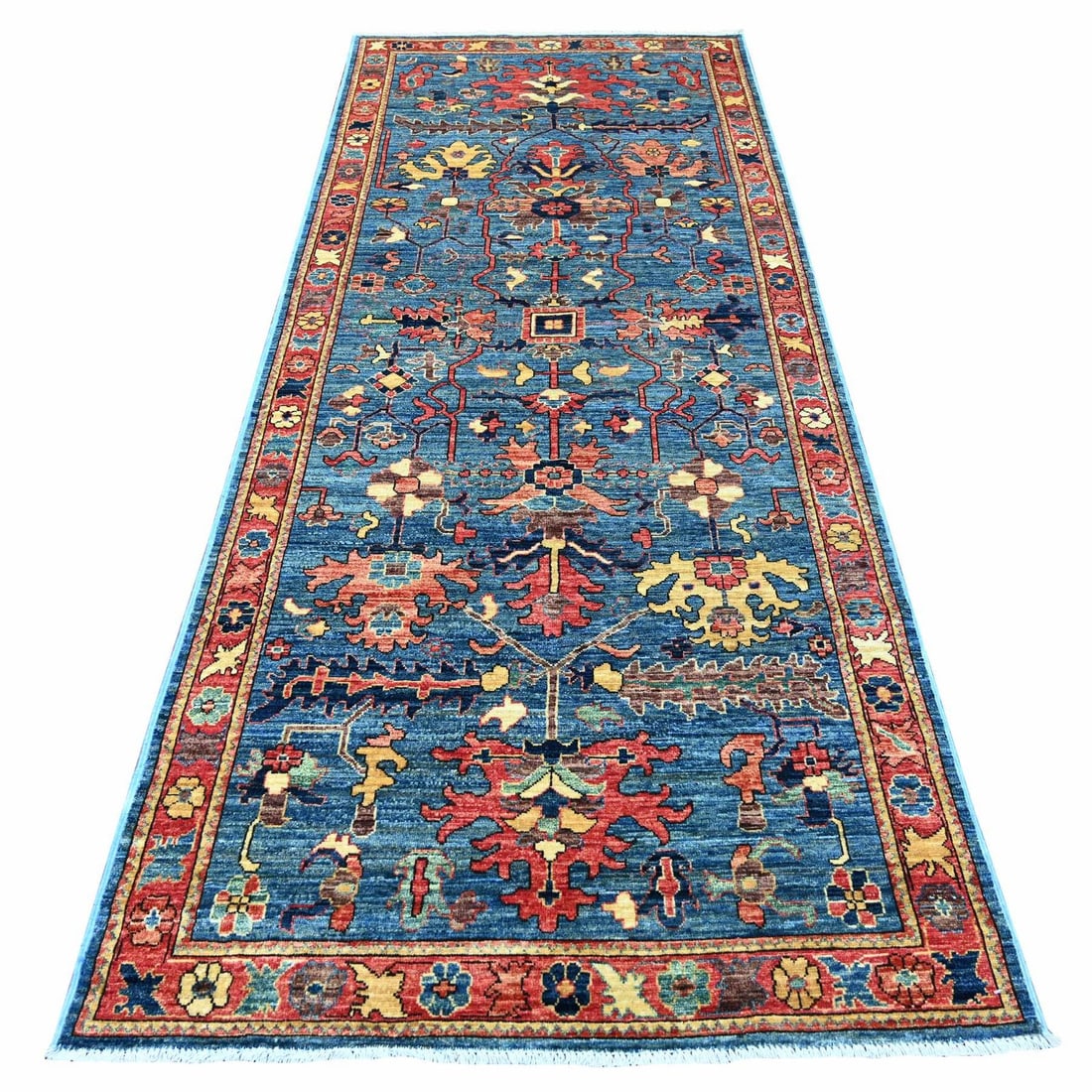 4'x10' Blue Heris All Over Design Wool Hand Knotted Soft Pile Runner Rug: 4'x10' Blue Heris All Over Design Wool Hand Knotted Soft Pile Runner Rug Soft underfoot, the vibrant blue hue of this hand-knotted wool runner rug adds warmth and depth to any indoor space. Measuring 