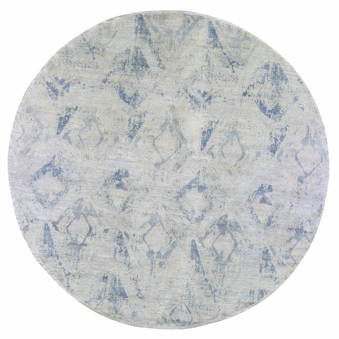 Ivory Large Elements with Pastels Silk Wool Round Modern Rug: Ivory Large Elements with Pastels Silk Wool Round Modern Rug Made from luxurious wool and silk, this hand-knotted round rug boasts an elegant ivory color. Featuring a classic oriental design with subt