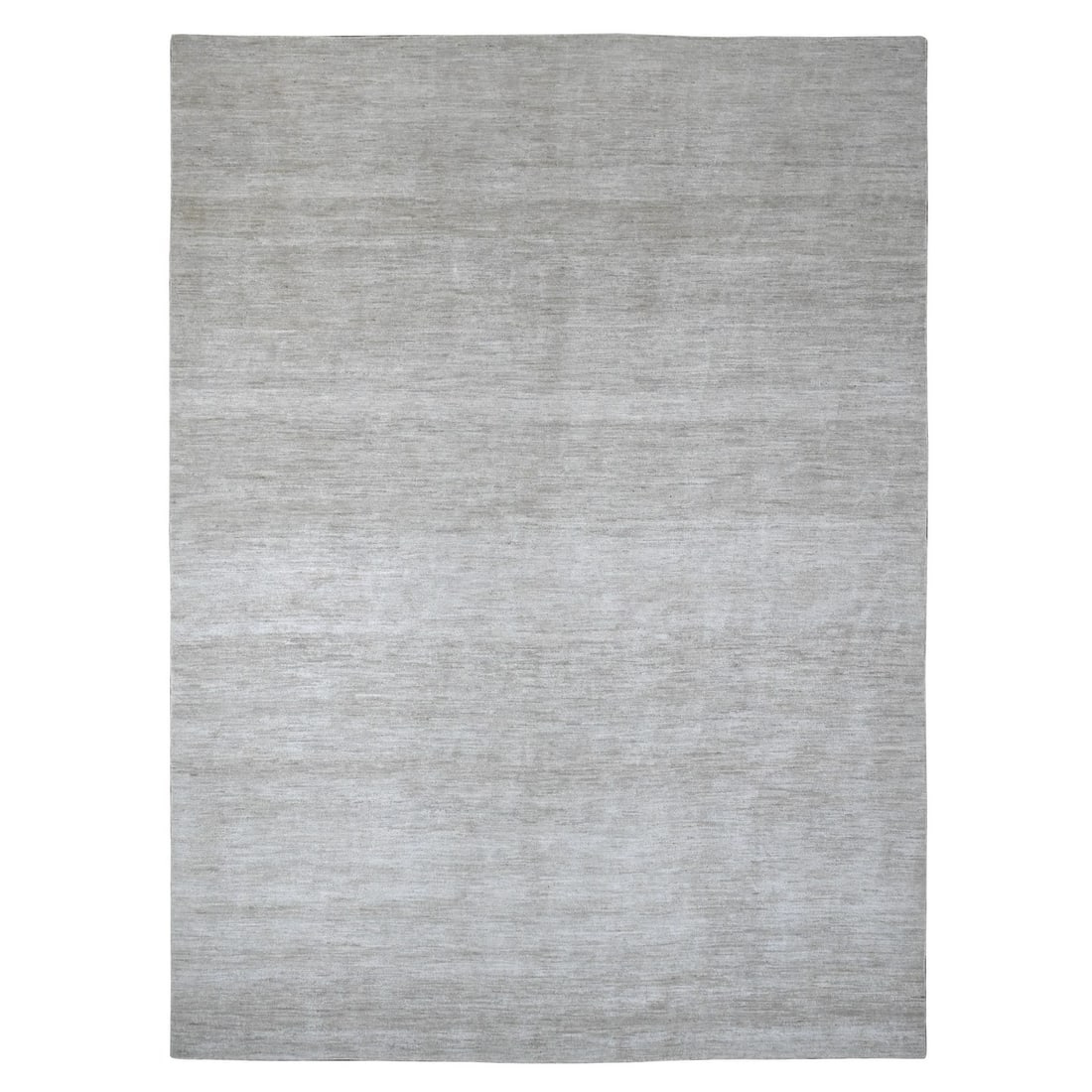 8'7"x11'9" Cloud Gray Solid Design Hand Knotted Hand Spun Ghazni Wool Rug: 8'7"x11'9" Cloud Gray Solid Design Hand Knotted Hand Spun Ghazni Wool Rug Solidly crafted with hand-spun Ghazni wool, this 8'7"x11'9" Cloud Gray rug boasts a rectangular field design that showcases th