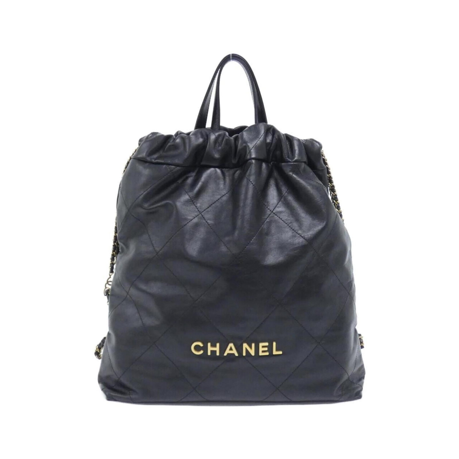 Leather Backpack By Chanel: Leather Backpack By Chanel Leather Backpack by Chanel features a sleek black design made from high-quality Calfskin leather, with a durable construction and sturdy dimensions of 40cm x 35cm x 8cm.