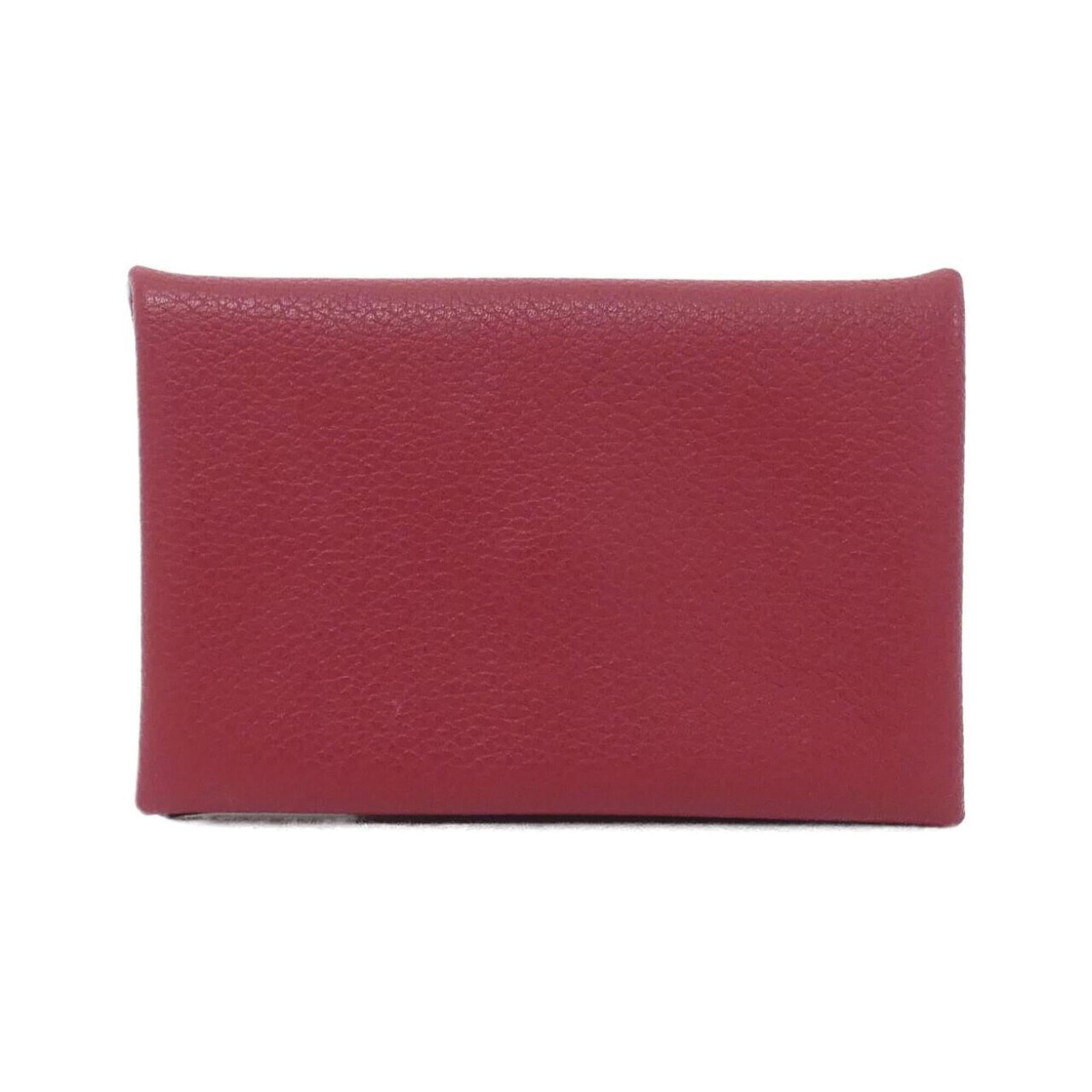 Card case Hermes: Card case Hermes The Hermes Card Case in Rouge Grenat boasts sleek dimensions and vibrant color, measuring 7cm x 10.5cm x 1.5cm. Its compact size makes it a practical accessory for everyday use, while