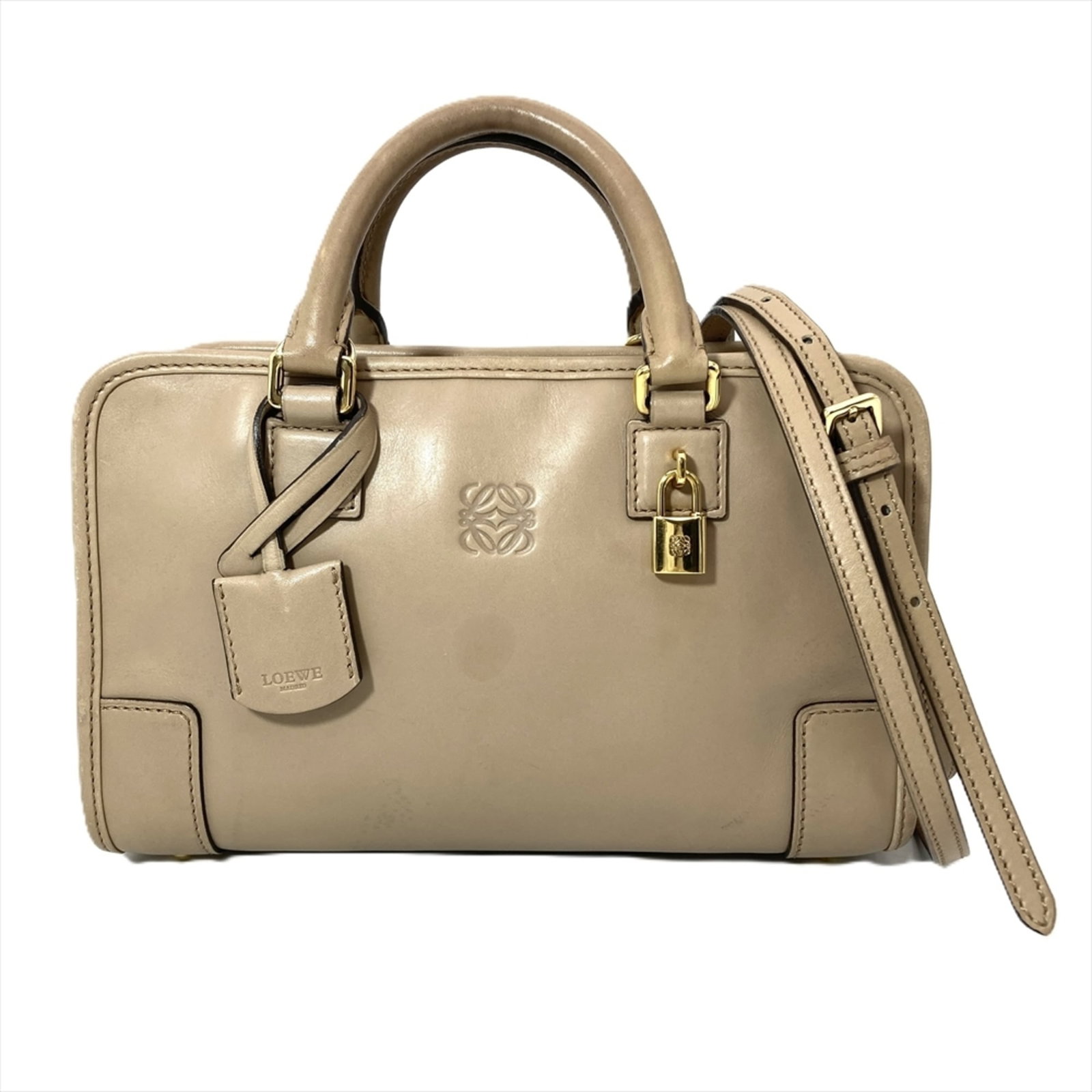 Handbag Leather by Loewe: Handbag Leather by Loewe This exquisite handbag features high-quality calfskin leather from renowned Spanish brand Loewe, crafted with attention to detail and timeless elegance. Measuring 15cm x 24cm 
