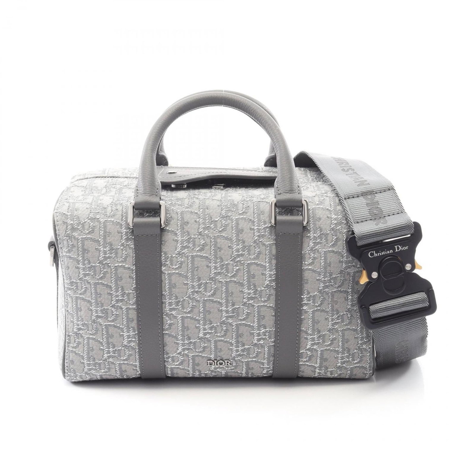 Canvas leather handbag by Christian Dior: Canvas leather handbag by Christian Dior Canvas leather handbag by Christian Dior, featuring a gray color and compact size. Made from canvas and leather, this bag measures 15cm x 26cm x 14cm. The