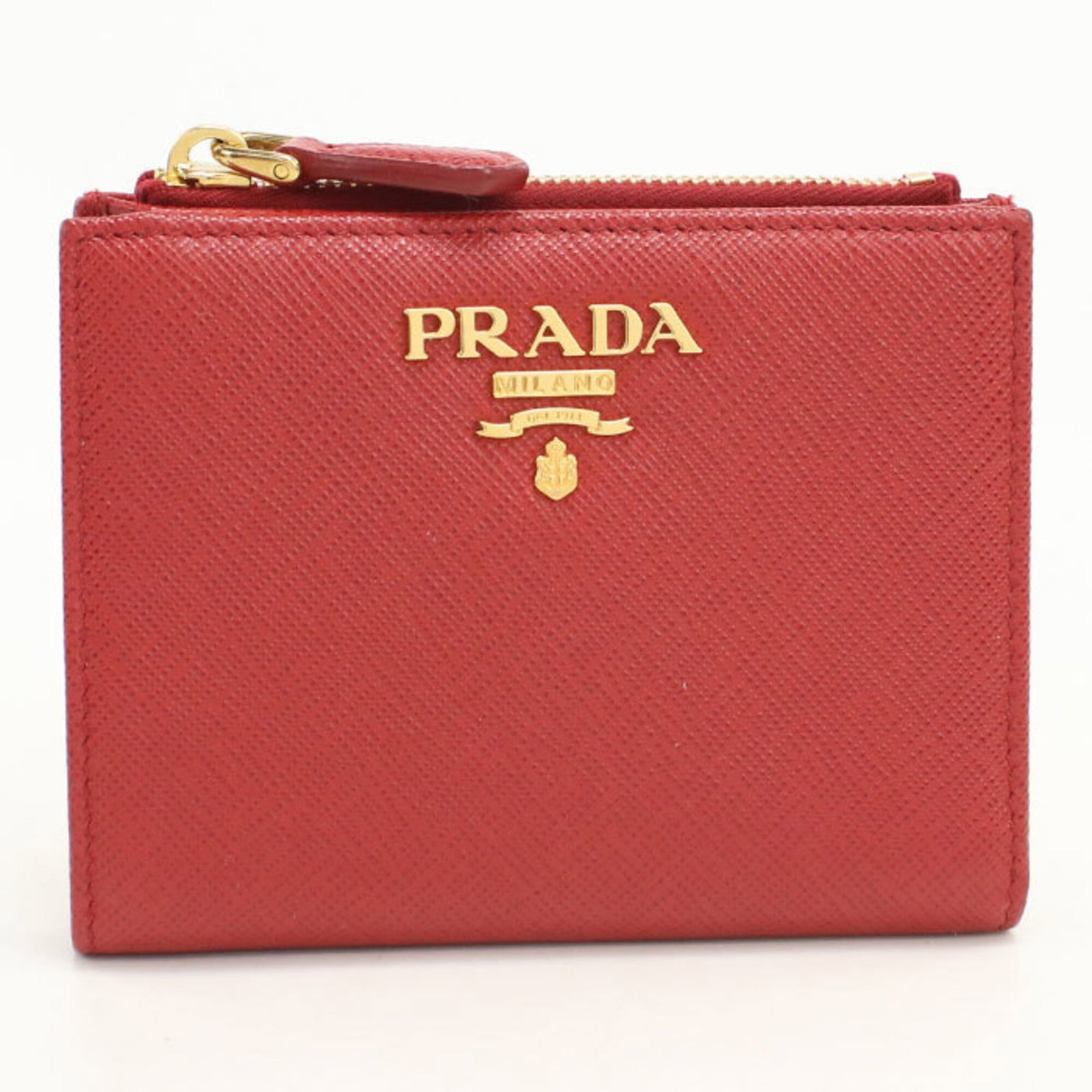 Prada Wallet (Bi-Fold) Leather: Prada Wallet (Bi-Fold) Leather Prada Country of Origin: Italy, Material: Leather, Color: Red. This bi-fold wallet from Prada features high-quality leather construction and a classic design. Measuring