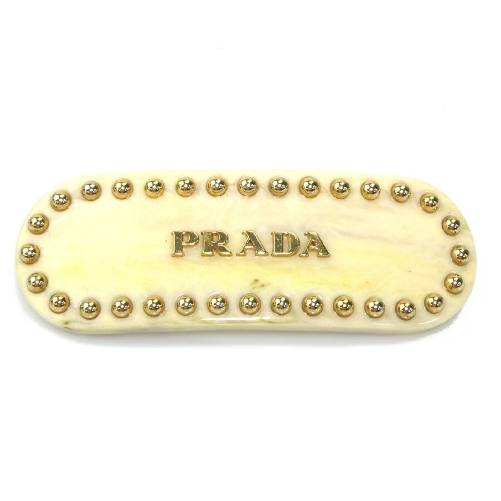 Resin Barrette Prada: Resin Barrette Prada Resin Barrette Prada bears a signature and is made from resin, with a beige color. The item measures 2.5cm x 7cm and comes in a box. It originates from Italy. Item Specifics: Bran