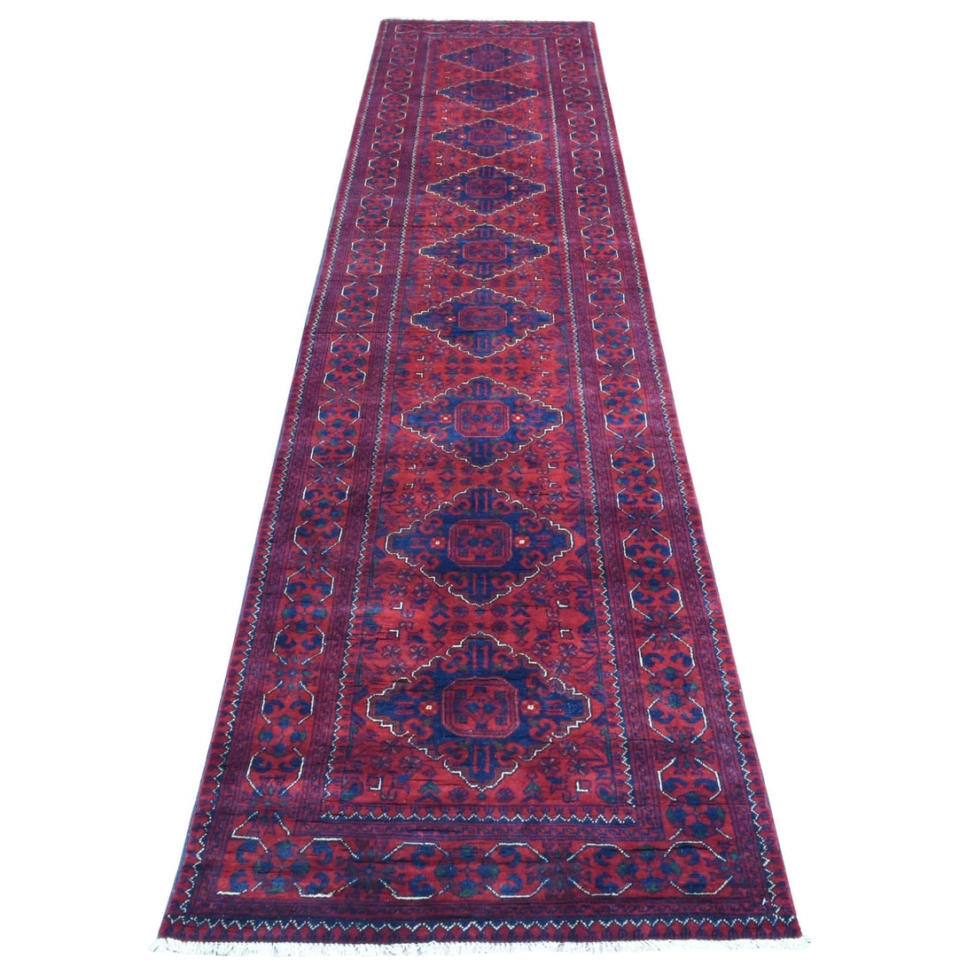 2'10"x13' Red Afghan Khamyab Soft Wool Hand Knotted Runner Rug: 2'10"x13' Red Afghan Khamyab Soft Wool Hand Knotted Runner Rug Red Afghan Khamyab Soft Wool Hand Knotted Runner Rug measures 2'10" x 13', showcasing its vibrant red color and unique hand-knotted