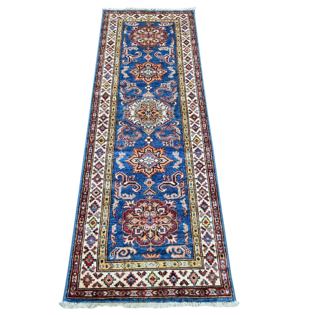 2'1"x6' Blue Afghan Super Kazak Hand Knotted Pure Wool Narrow Runner Rug: 2'1"x6' Blue Afghan Super Kazak Hand Knotted Pure Wool Narrow Runner Rug The Blue Afghan Super Kazak Hand Knotted Pure Wool Narrow Runner Rug boasts an all-over regional design in rich blue hues,