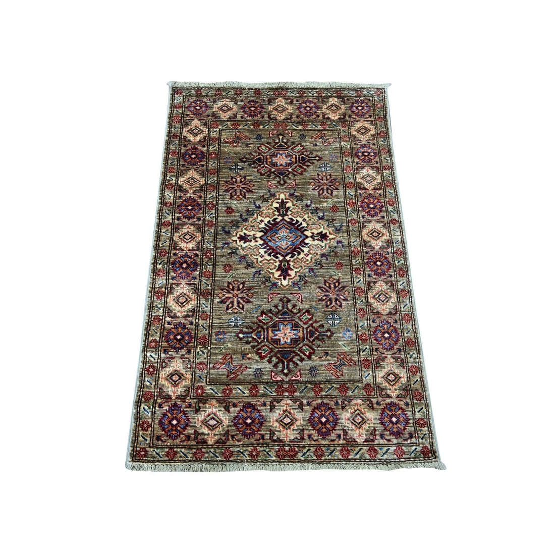 2'7"x4'1" Stone Gray Afghan Super Kazak Hand Knotted Wool Sample Mat Rug: 2'7"x4'1" Stone Gray Afghan Super Kazak Hand Knotted Wool Sample Mat Rug The Stone Gray Afghan Super Kazak Hand Knotted Wool Sample Mat Rug boasts an all-over regional design, showcasing the