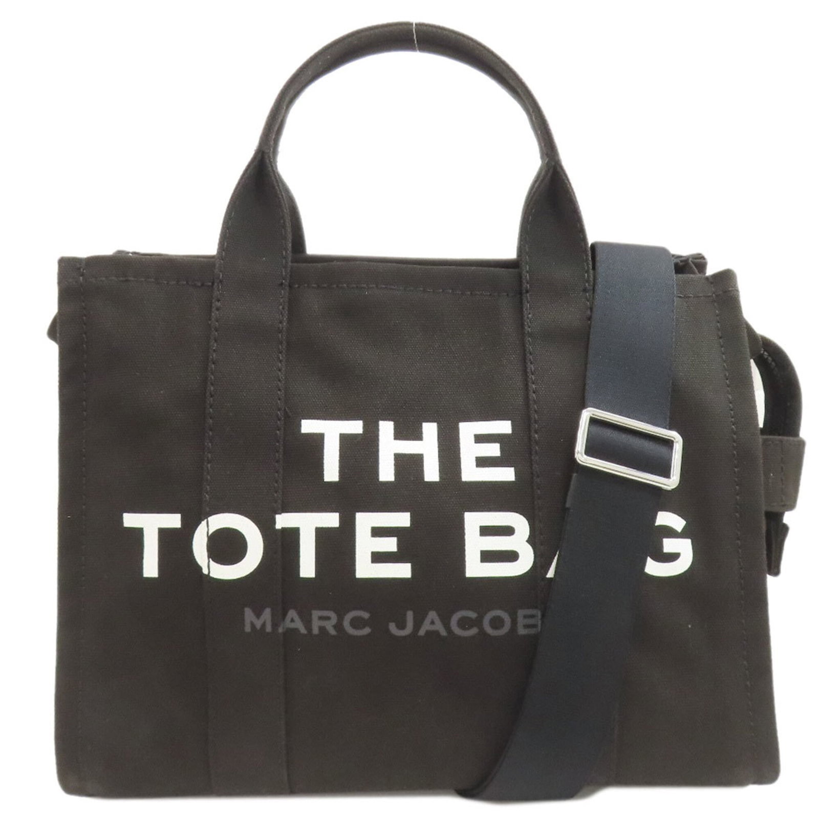 Canvas Tote Handbag Jacobs Marc: Canvas Tote Handbag Jacobs Marc Canvas Tote Handbag Jacobs Marc - A stylish and practical tote bag made from canvas, featuring a black color and zipper closure. Measuring 25cm x 33cm x 15cm, it has a