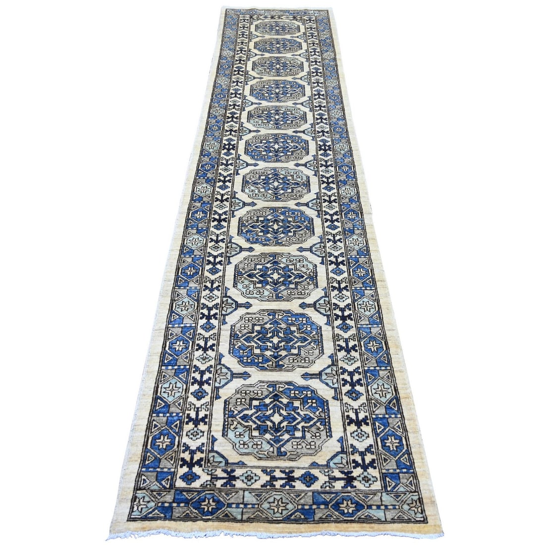 2'7"x11'8" Ivory Afghan Ersari Elephant Feet Design Hand Knotted Wool Runner: 2'7"x11'8" Ivory Afghan Ersari Elephant Feet Design Hand Knotted Wool Runner This stunning ivory Afghan Ersari elephant feet design hand knotted wool runner boasts an impressive 11'8" length and intri
