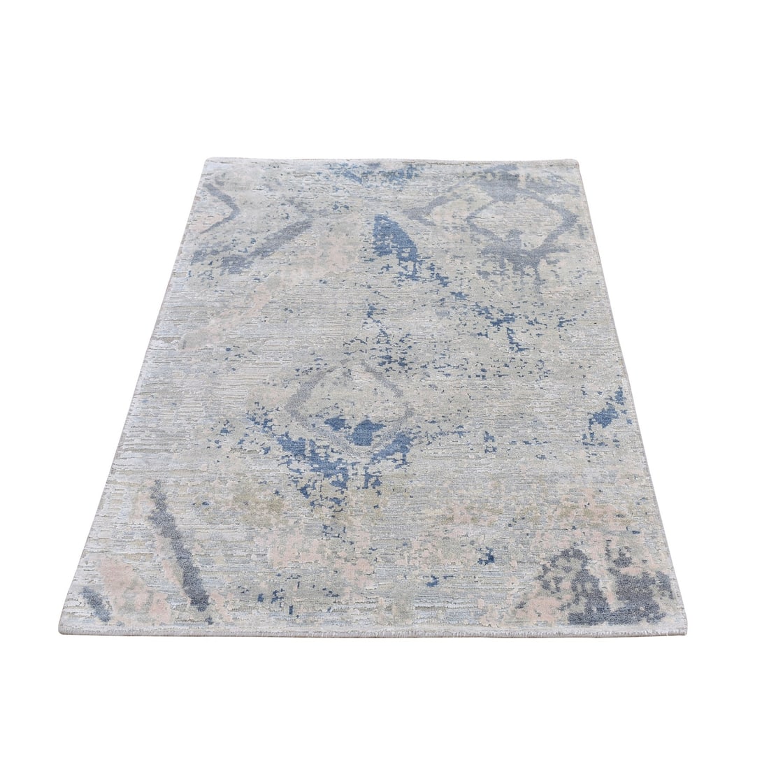 3'x5'5" Large Elements with Pastels Silk with Textured Wool Hand Made Rug: 3'x5'5" Large Elements with Pastels Silk with Textured Wool Hand Made Rug Woven from luxurious wool and silk, this hand-knotted Oriental rug boasts a soft ivory hue and intricate textured pattern. Its