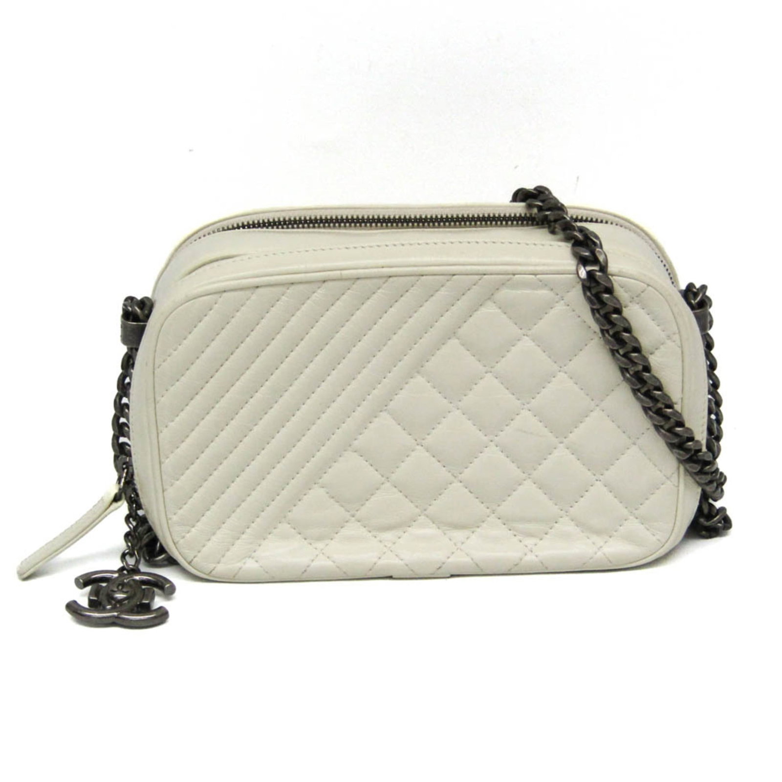 Leather Chanel Shoulder Bag: Leather Chanel Shoulder Bag The Cream Lambskin Leather Chanel Boy Camera Bag features a classic design with clean lines and timeless elegance. Made from high-quality lambskin leather, this shoulder ba