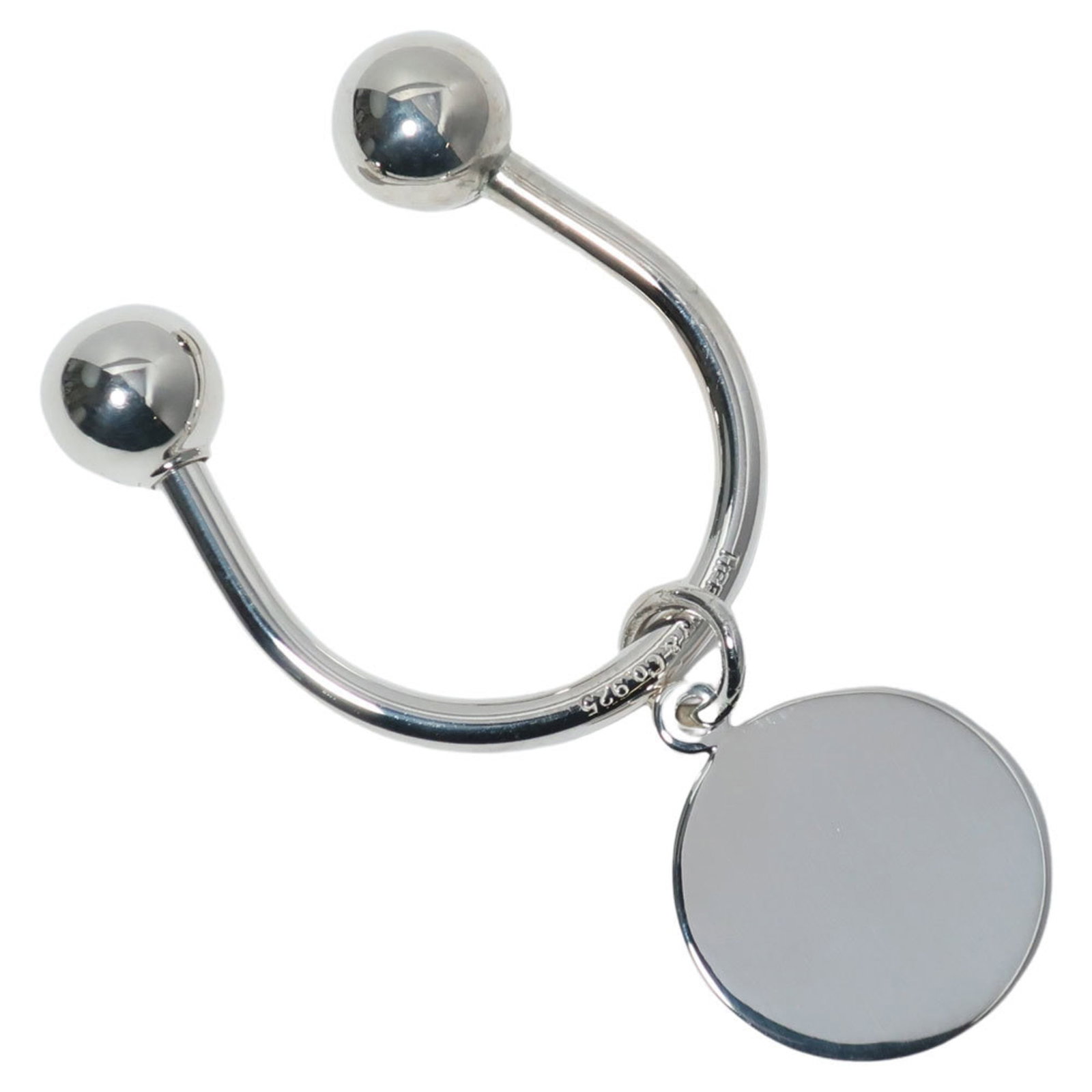 Tiffany Keyring Silver 925: Tiffany Keyring Silver 925 Silver 925 Tiffany Keyring. Made from high-quality silver, this elegant keyring boasts a sleek design with a diameter of 3cm and a charm size of 2.38cm. Weighing in at