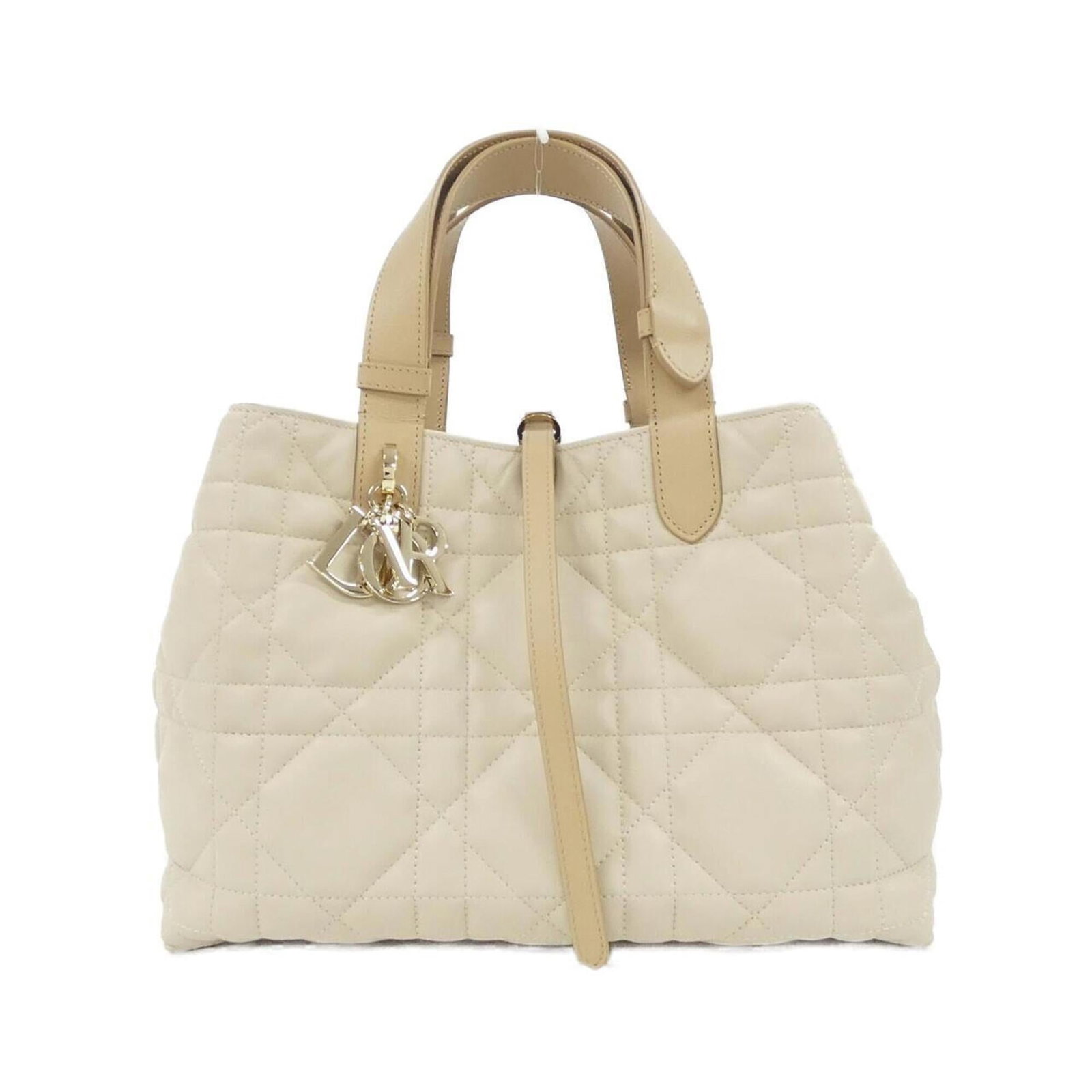 Handbag Leather Dior Christian: Handbag Leather Dior Christian Leather Dior Christian Handbag. This beige calfskin handbag features a classic design with a signature style from the luxury brand Christian Dior. Measuring 22cm x 29cm
