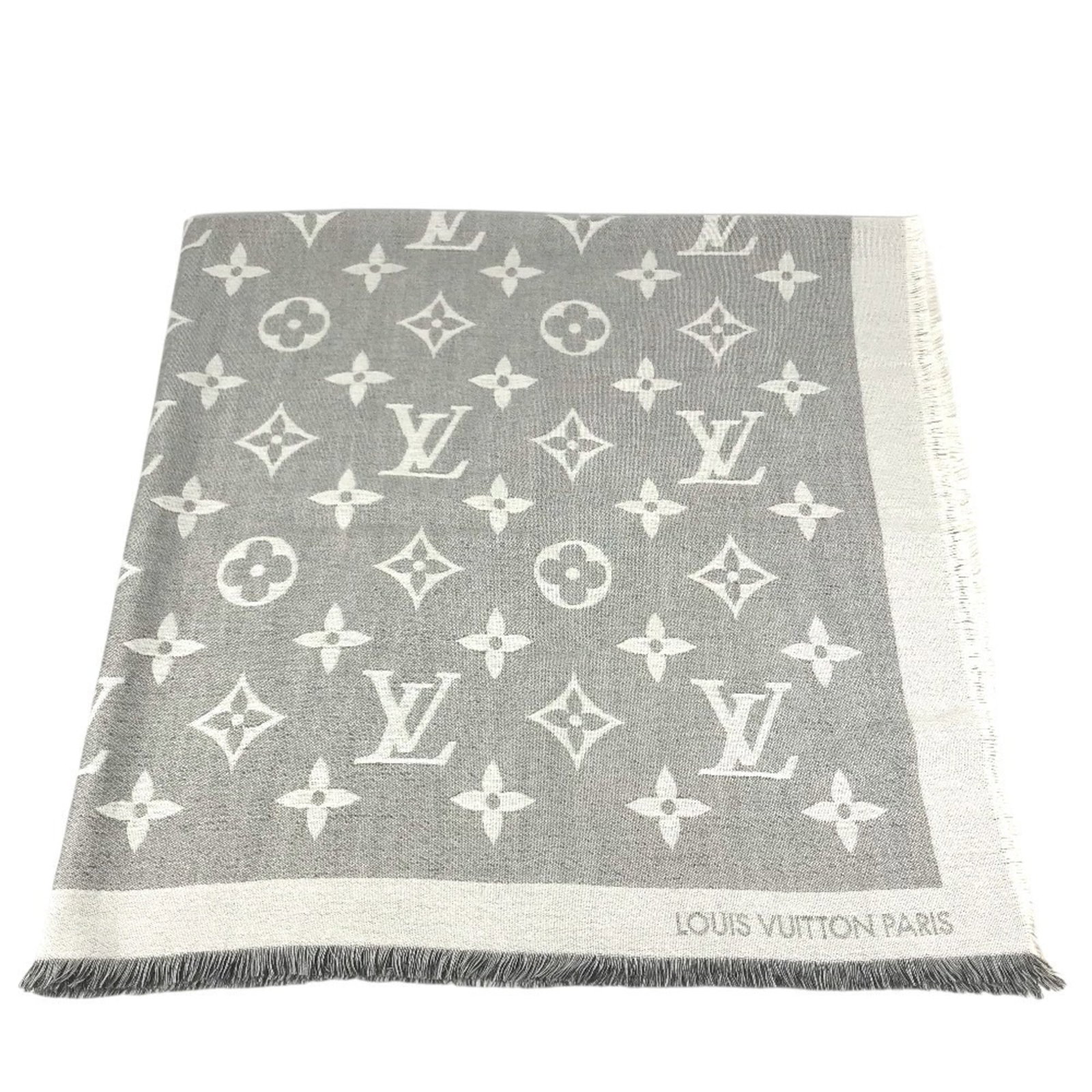 Vuitton Louis Shawl Monogram: Vuitton Louis Shawl Monogram The Louis Vuitton Monogram Shawl boasts a timeless design, featuring the iconic interlocking LV monogram pattern in gray and white hues. Made from high-quality materials, 
