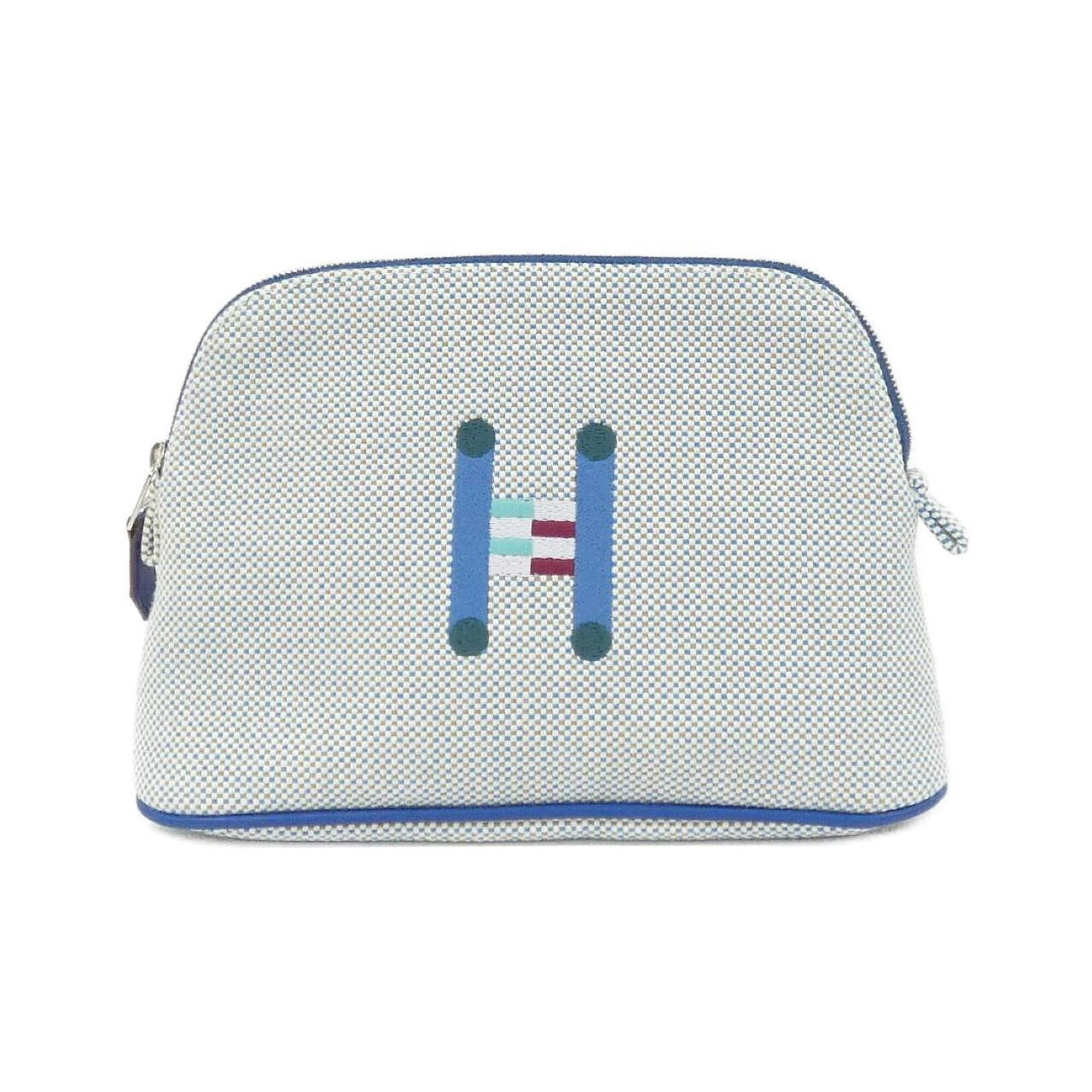 Canvas pouch handbag Hermes: Canvas pouch handbag Hermes Canvas pouch handbag from Hermes, featuring blue canvas material and dimensions of 14cm x 20cm x 6cm. This stylish bag boasts a classic design with clean lines and a compac