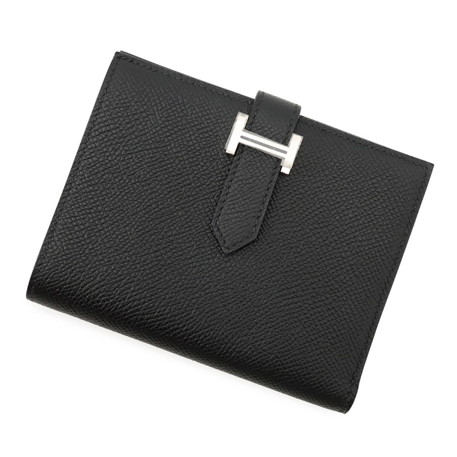 Hermes Wallet (Bi-Fold) Epsom Leather: Hermes Wallet (Bi-Fold) Epsom Leather Epsom leather craftsmanship shines in this sleek bi-fold wallet from Hermes, expertly crafted with attention to detail. Measuring 9.5cm x 12cm, the black Epsom le