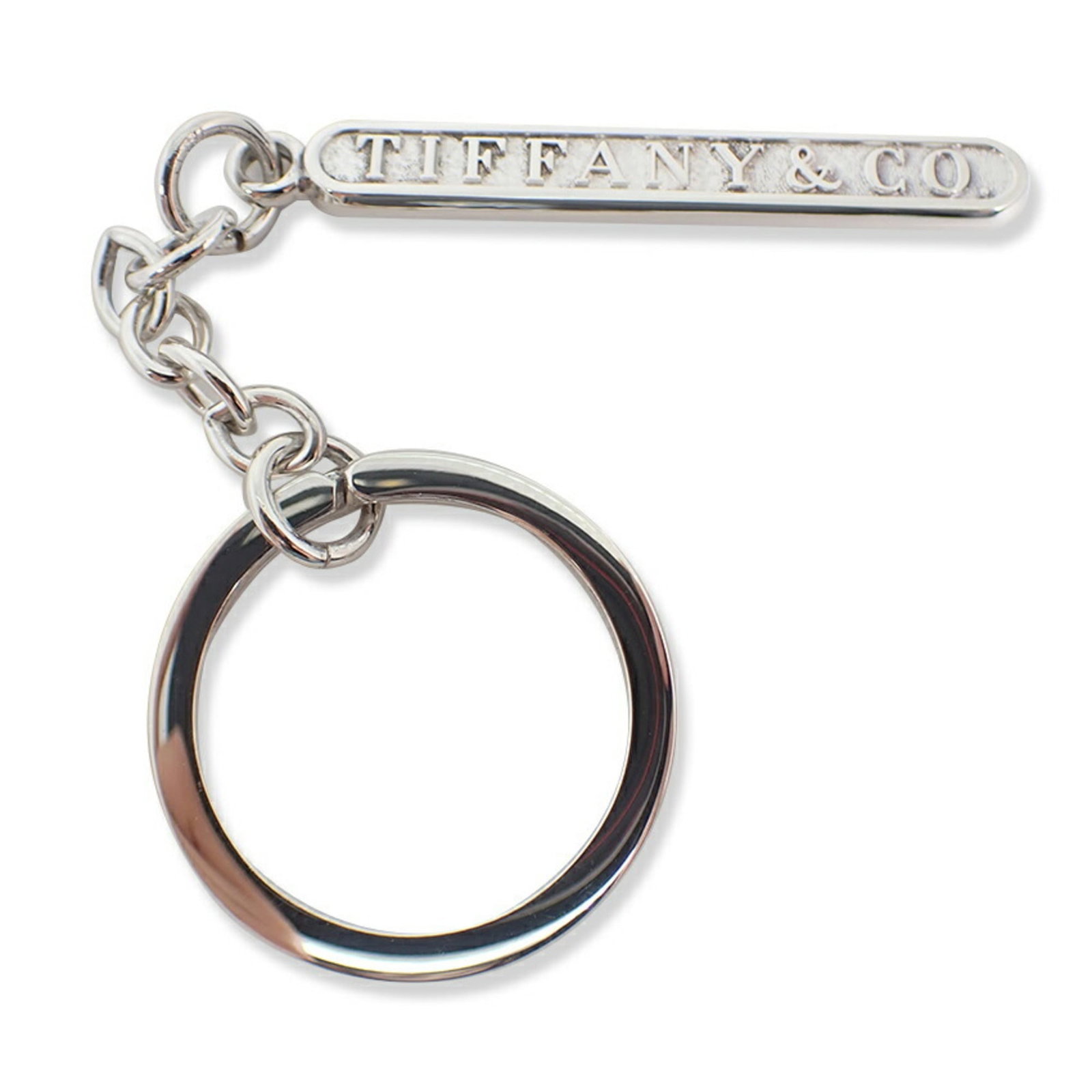 Sterling Silver 925 Keyring Tiffany: Sterling Silver 925 Keyring Tiffany Sterling silver 925 Keyring Tiffany bears a signature. Made from high-quality sterling silver, this elegant keyring showcases the iconic style of Tiffany. Its timel