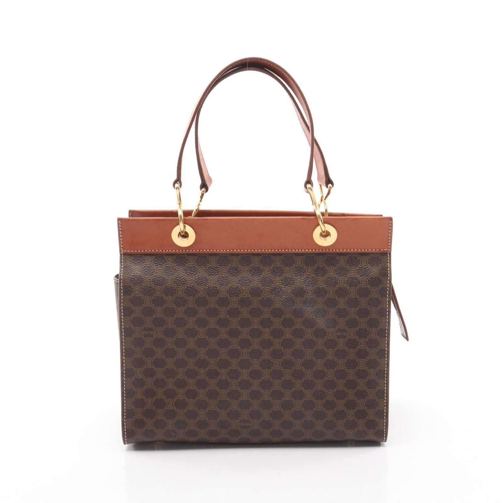 Canvas leather handbag coated by Celine: Canvas leather handbag coated by Celine Coated canvas and leather come together in this Celine handbag, featuring a brown color and dimensions of 22cm x 25cm x 13cm. The bag's coated canvas material