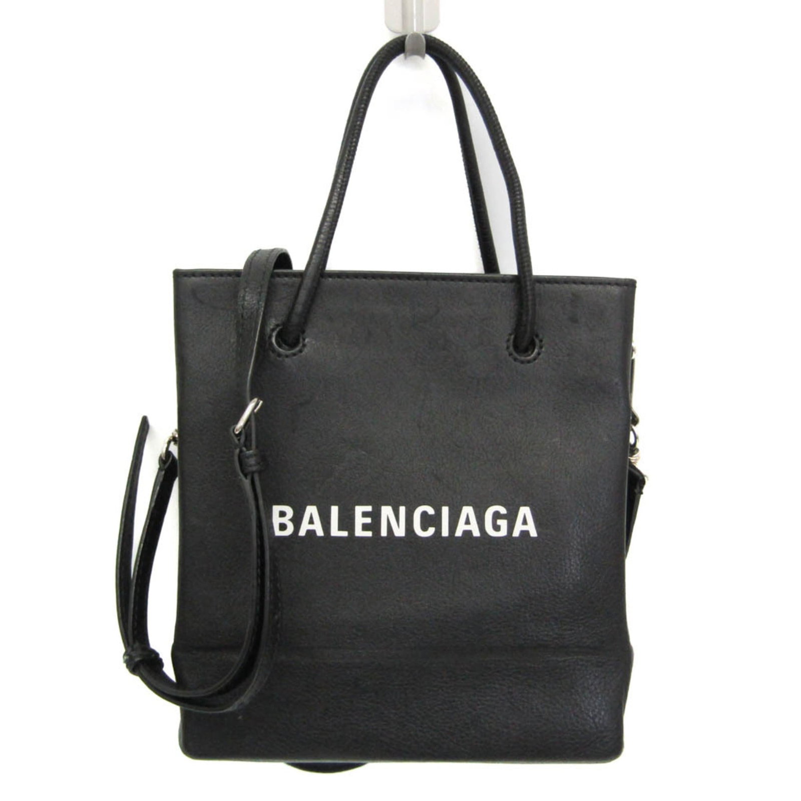 Bag tote leather bag shoulder Balenciaga: Bag tote leather bag shoulder Balenciaga Black leather Balenciaga tote bag with silver hardware, featuring an adjustable strap and zipper pocket. The bag has a small indentation on the back and