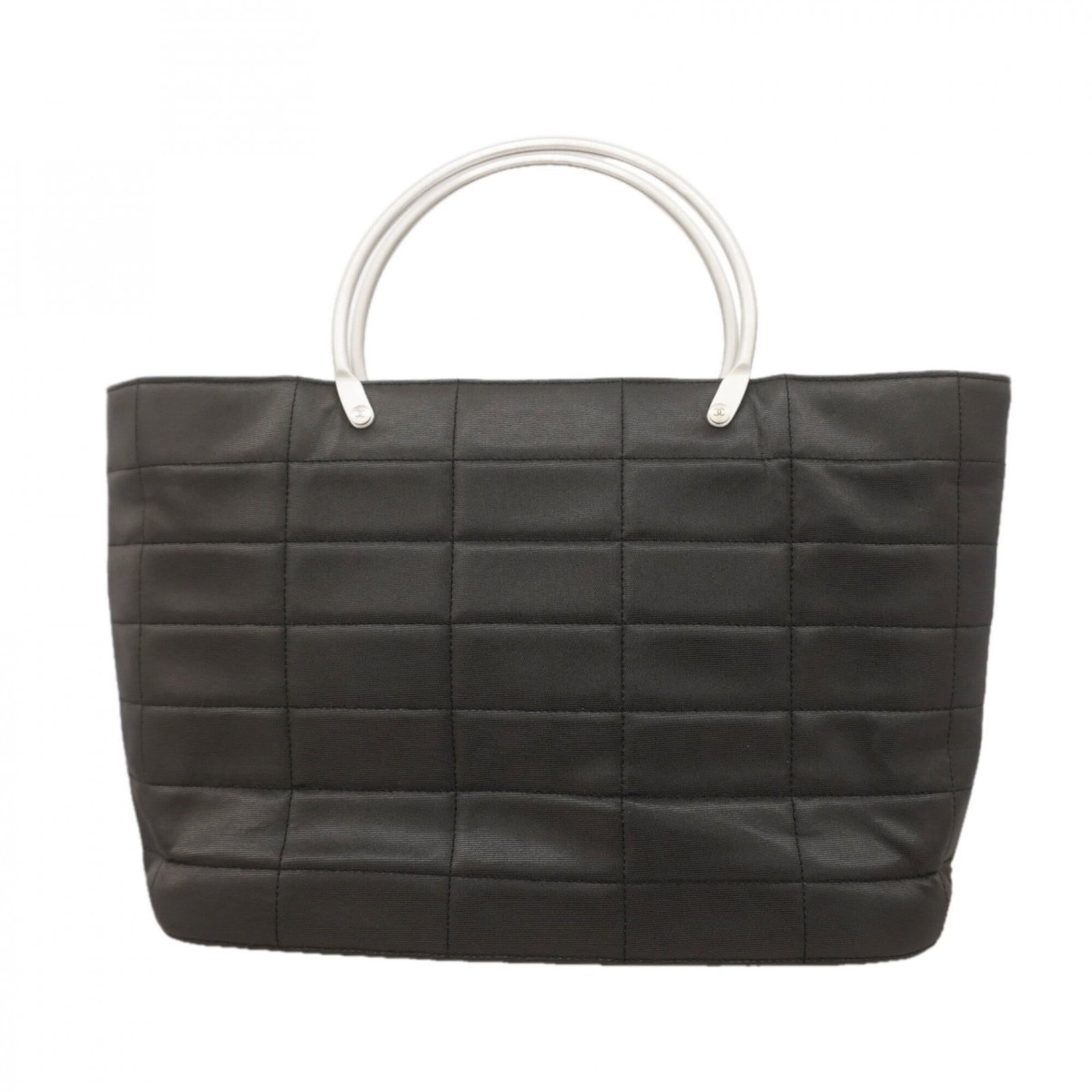Handbag Nylon By Chanel: Handbag Nylon By Chanel Black nylon handbag by Chanel, featuring silver hardware and a sleek design. Made from durable nylon material, this classic style measures 19.5cm x 27cm x 9cm. A timeless