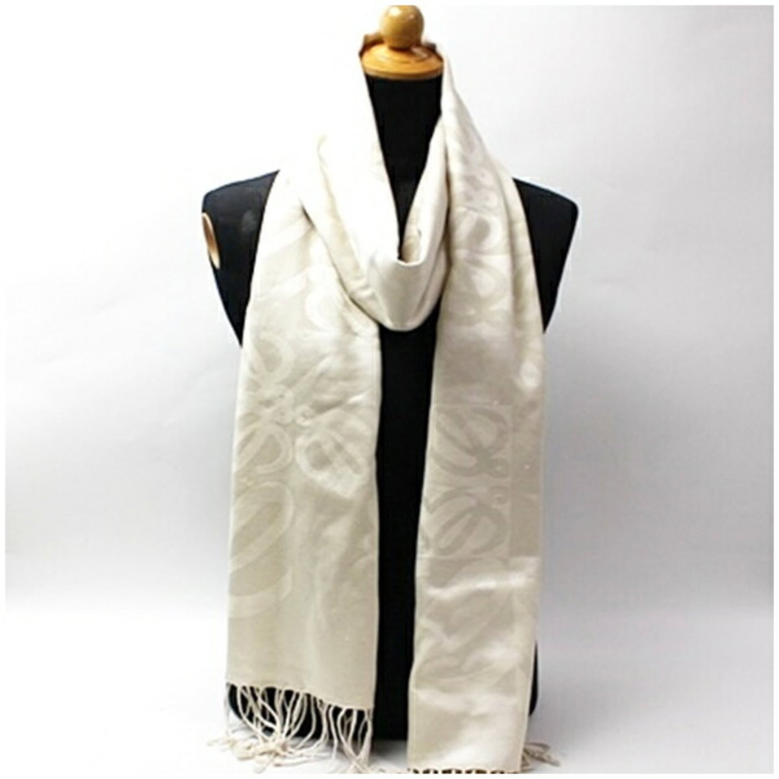 Silk Cashmere Stole: Silk Cashmere Stole Silk and cashmere blend creates a luxurious texture in this white stole, measuring 2.14m x 62cm. The combination of silk and cashmere provides a soft and warm feel, perfect for add