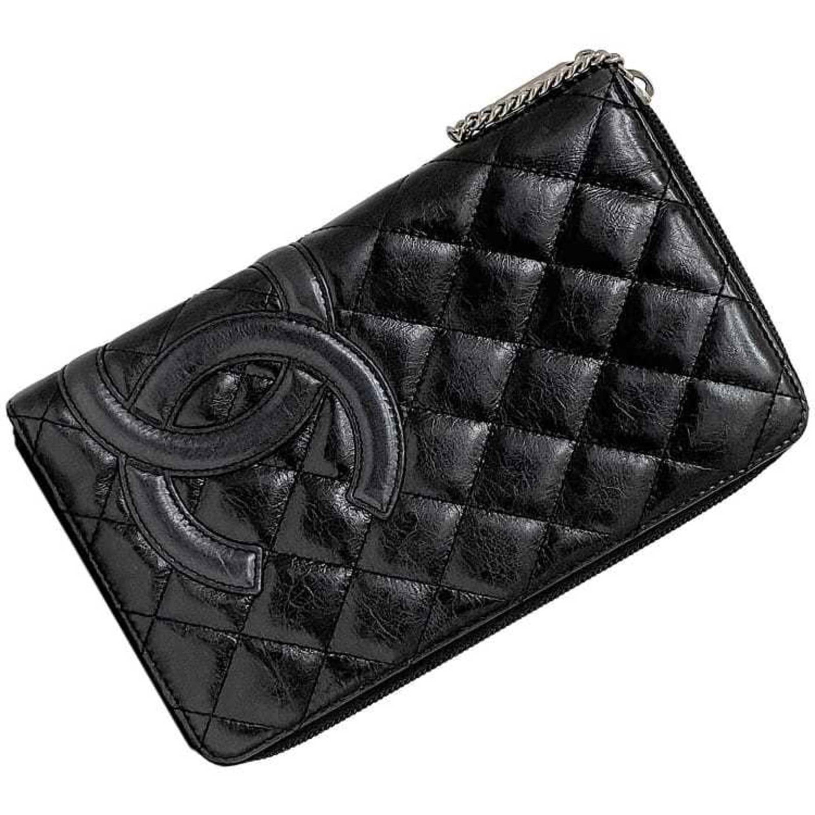 Wallet leather bi fold Chanel: Wallet leather bi fold Chanel Black leather bi-fold wallet from Chanel, measuring 13cm x 20.5cm x 2cm. This long wallet features a classic design made from high-quality leather. A simple yet elegant