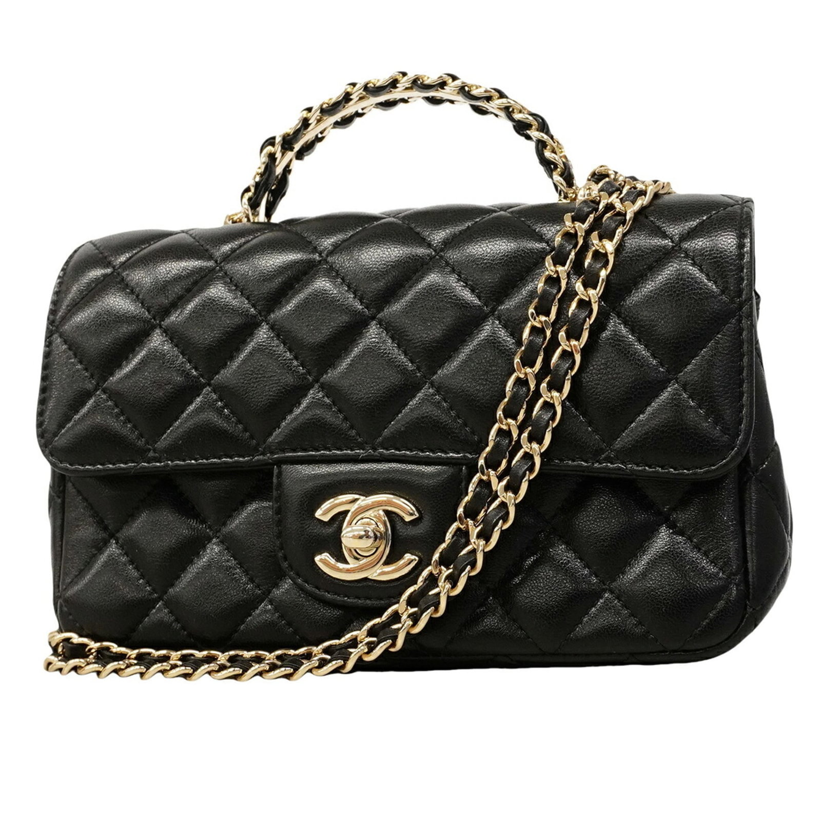 Leather Handbag Chanel: Leather Handbag Chanel This luxurious Chanel handbag boasts sleek, all-black lambskin leather and champagne gold hardware for an elegant touch. Measuring just 5.51'' x 7.67'' x 2.55'', it's the