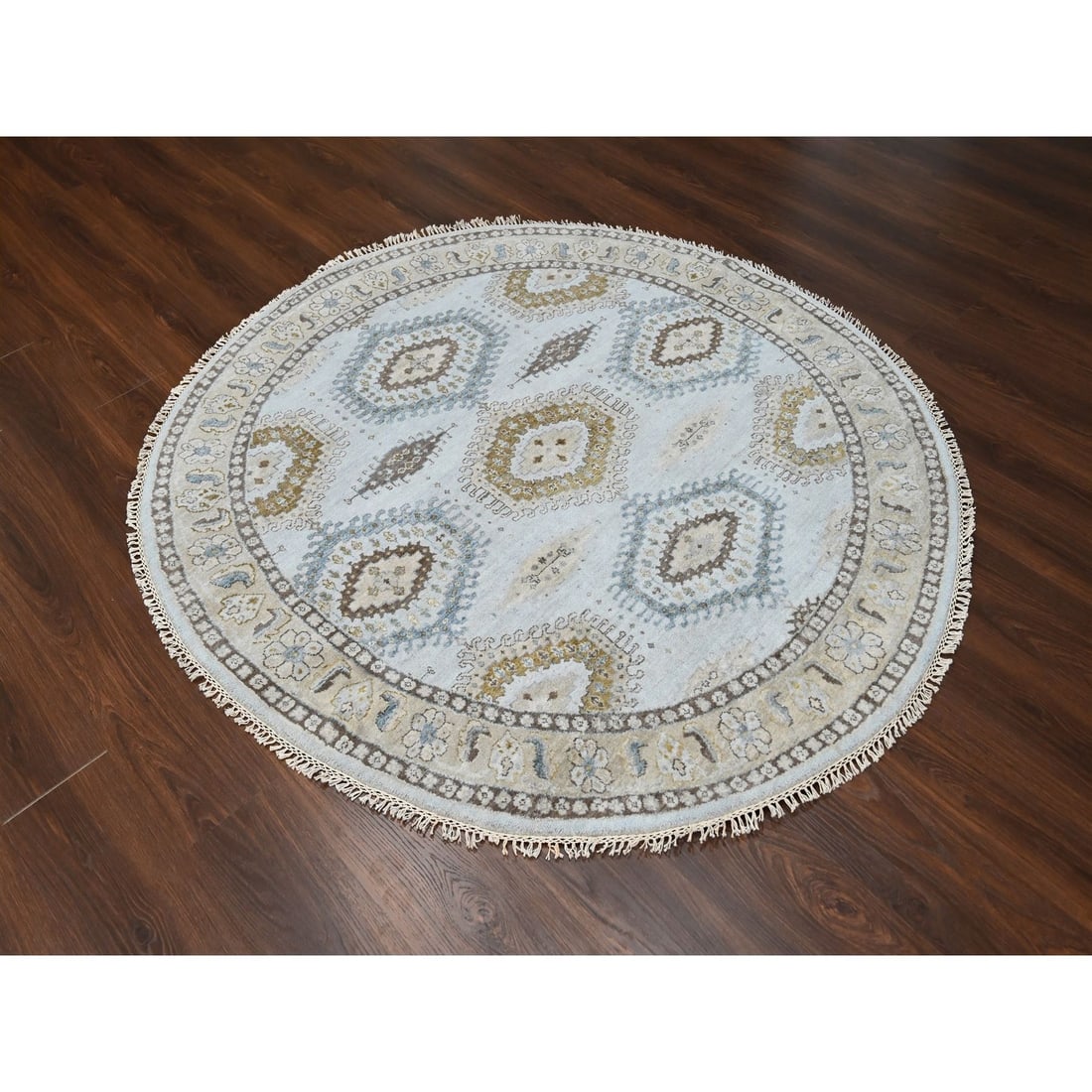 Village Inspired Hand Knotted Round Rug 6' Gray 100% Wool Zoroastrian: Village Inspired Hand Knotted Round Rug 6' Gray 100% Wool Zoroastrian Hand-knotted in 100% wool, this stunning Zoroastrian-inspired round rug boasts a rich gray field color and subtle border in ivory.