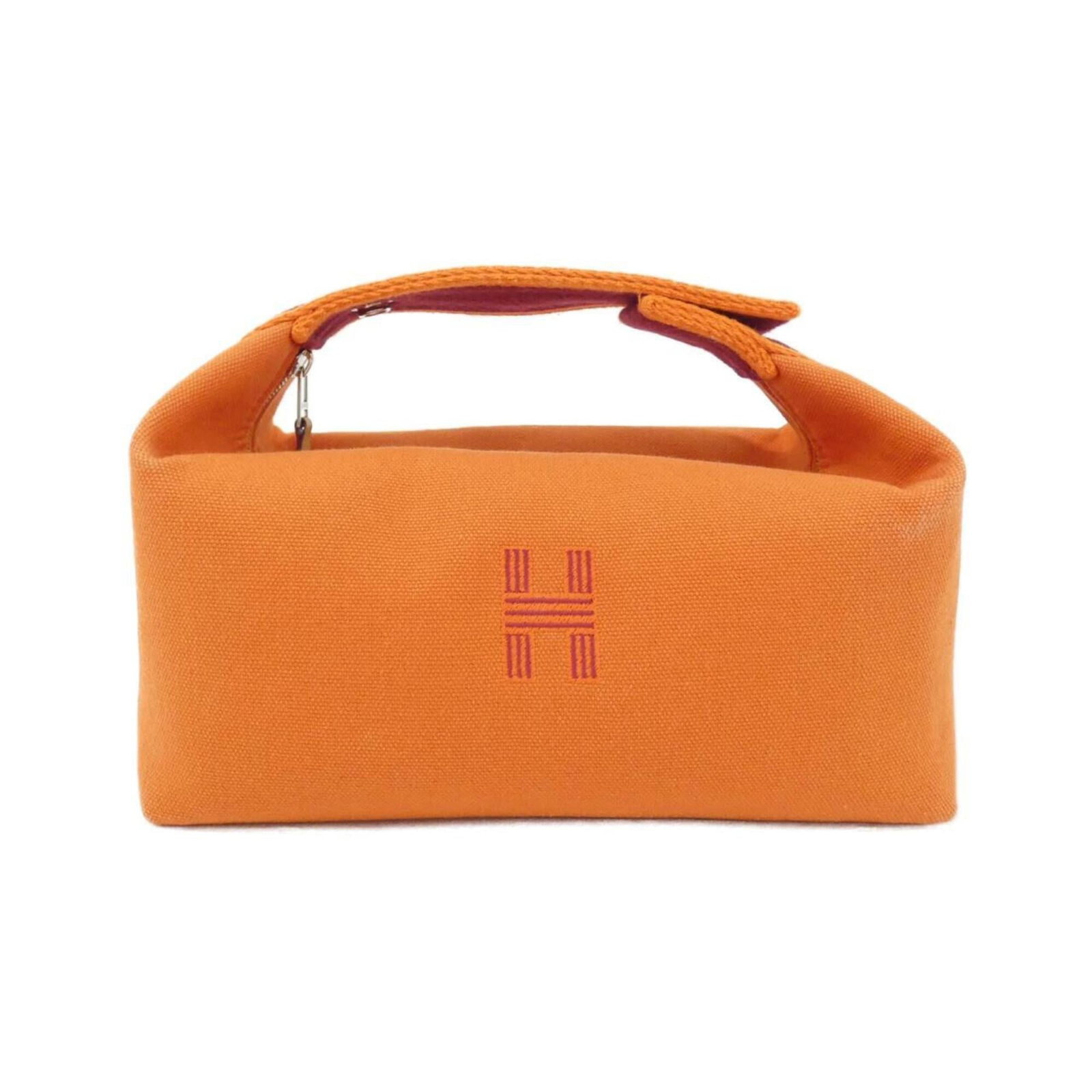Canvas pouch handbag Hermes: Canvas pouch handbag Hermes Canvas pouch handbag from Hermes, featuring an iconic orange canvas material and silver hardware. This compact bag measures 12cm x 21cm x 12cm, making it a stylish and port