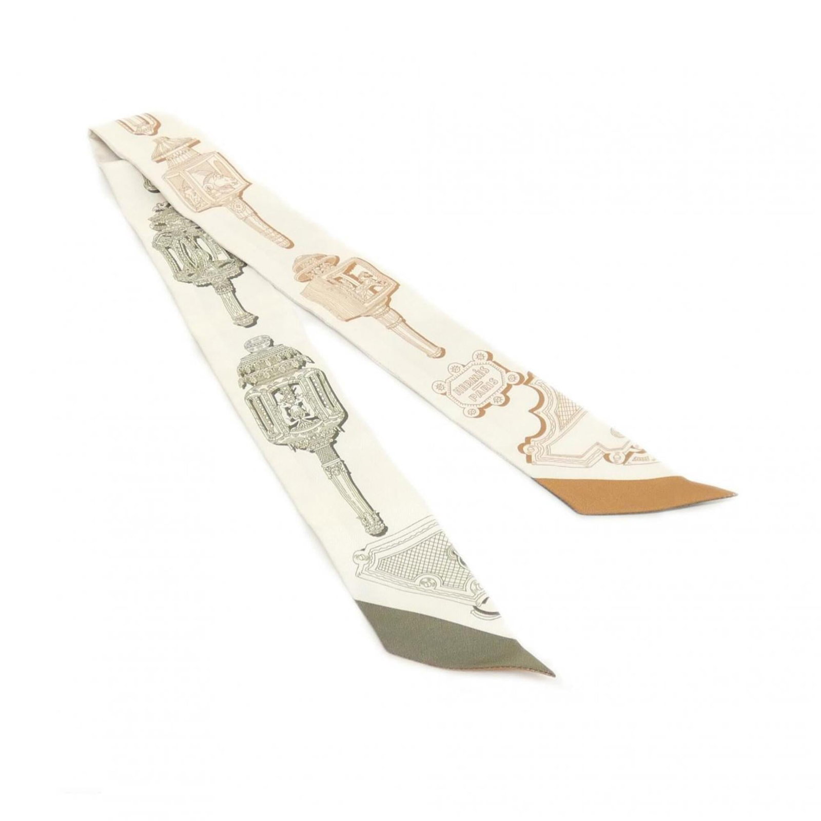 Silk by Hermes: Silk by Hermes Silk by Hermes features a timeless beige color, crafted from high-quality silk material. Measuring 5cm x 86cm, this elegant scarf is perfect for adding a touch of sophistication to any