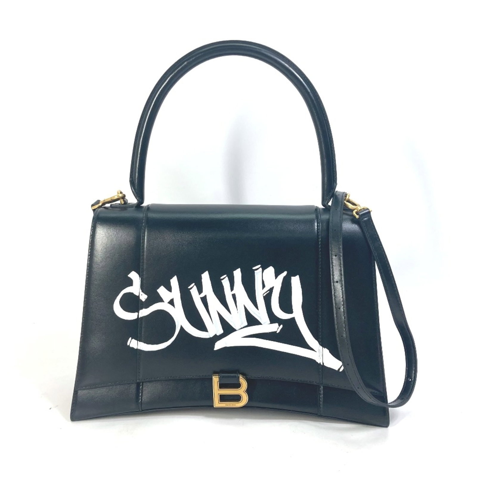 Balenciaga Handbag Leather: Balenciaga Handbag Leather Black leather Balenciaga handbag with dimensions 21cm x32cm x10.5cm and shoulder drop of 44.7inch, made from high-quality leather material. This stylish bag features a