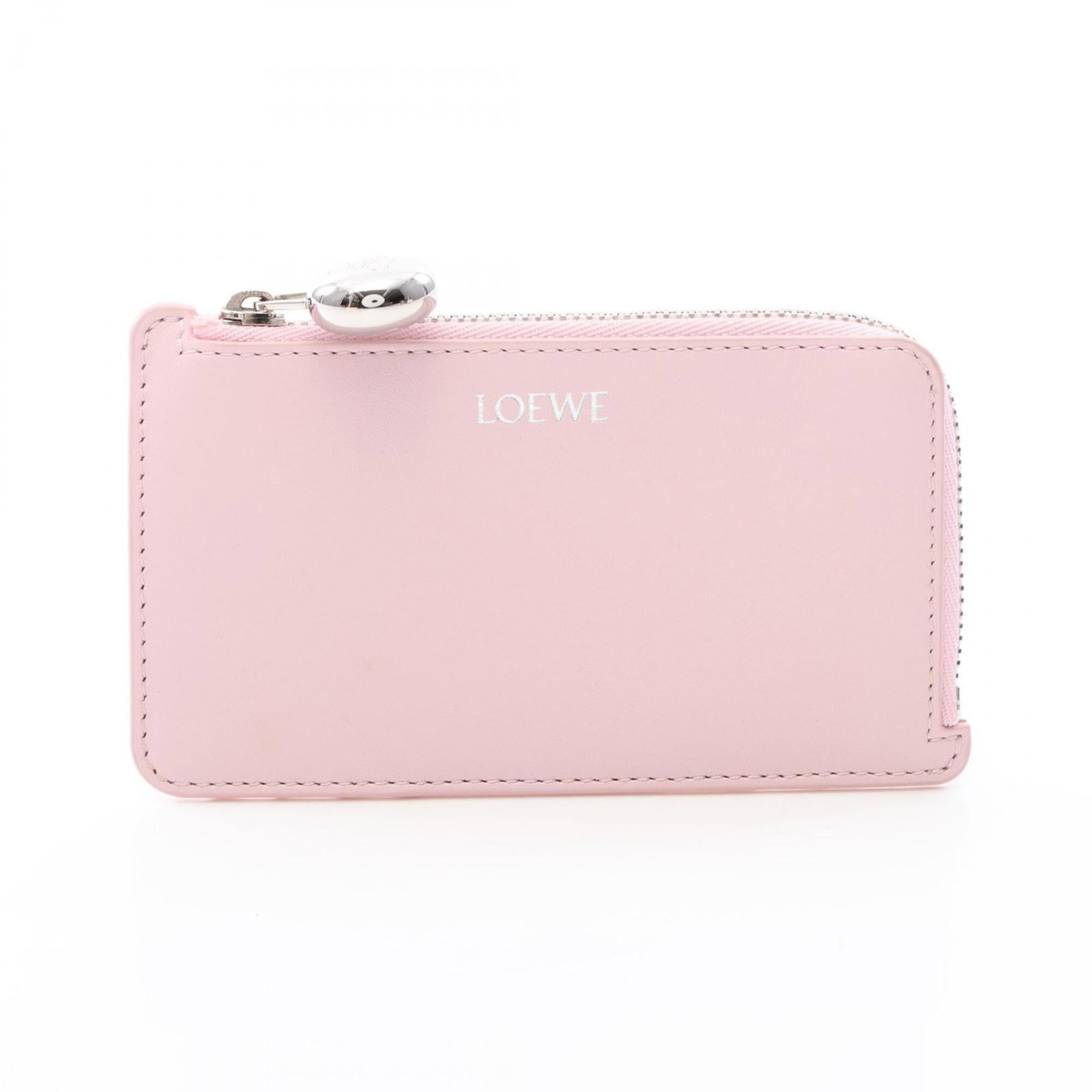 Card case leather by Loewe: Card case leather by Loewe Card case leather by Loewe features pink leather construction. The compact design measures 7cm x 13cm x 1cm, making it a convenient accessory for daily use. Item Specifics: 