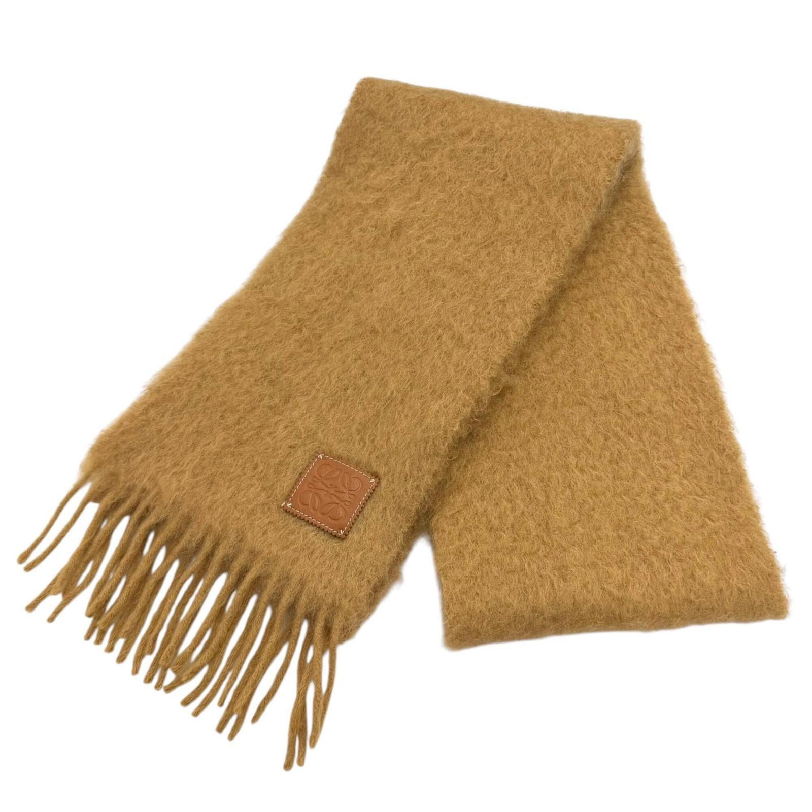 Stole Mohair Wool Nylon Loewe: Stole Mohair Wool Nylon Loewe Stole from renowned Spanish fashion brand Loewe, this unique piece combines the luxurious feel of mohair, wool, and nylon in a striking brown color. Measuring 1.81m x 22.