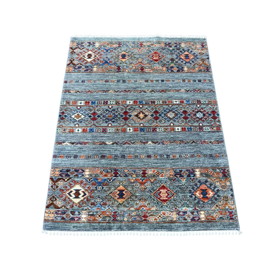 3'2x4'1" Gray Afghan Super Kazak Hand Knotted Pure Wool Sample Mat Rug: 3'2x4'1" Gray Afghan Super Kazak Hand Knotted Pure Wool Sample Mat Rug This stunning 3'2" x 4'1" Gray Afghan Super Kazak Hand Knotted Pure Wool Sample Mat Rug boasts an all-over regional design, chara