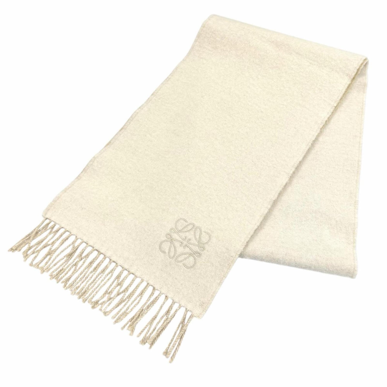 Loewe wool cashmere scarf: Loewe wool cashmere scarf Ivory wool cashmere scarf from Loewe, measuring 1.76m x 27cm, combining the warmth of wool and cashmere for a luxurious feel. Made in the United Kingdom, this scarf boasts a 