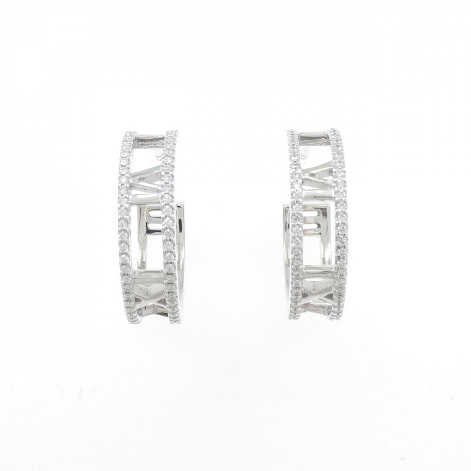 White Gold Hoop Earrings by Tiffany: White Gold Hoop Earrings by Tiffany White gold hoop earrings by Tiffany, featuring a sleek and modern design with a subtle shine. Made from high-quality white gold, these earrings boast a classic styl