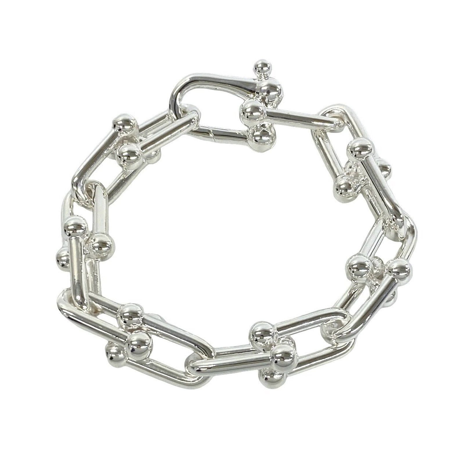 Tiffany Charm Bracelet Silver 925: Tiffany Charm Bracelet Silver 925 Silver 925 Tiffany Charm Bracelet, 16.5cm in length. This charm bracelet features the iconic Tiffany brand and is made from high-quality silver. Its sleek design make