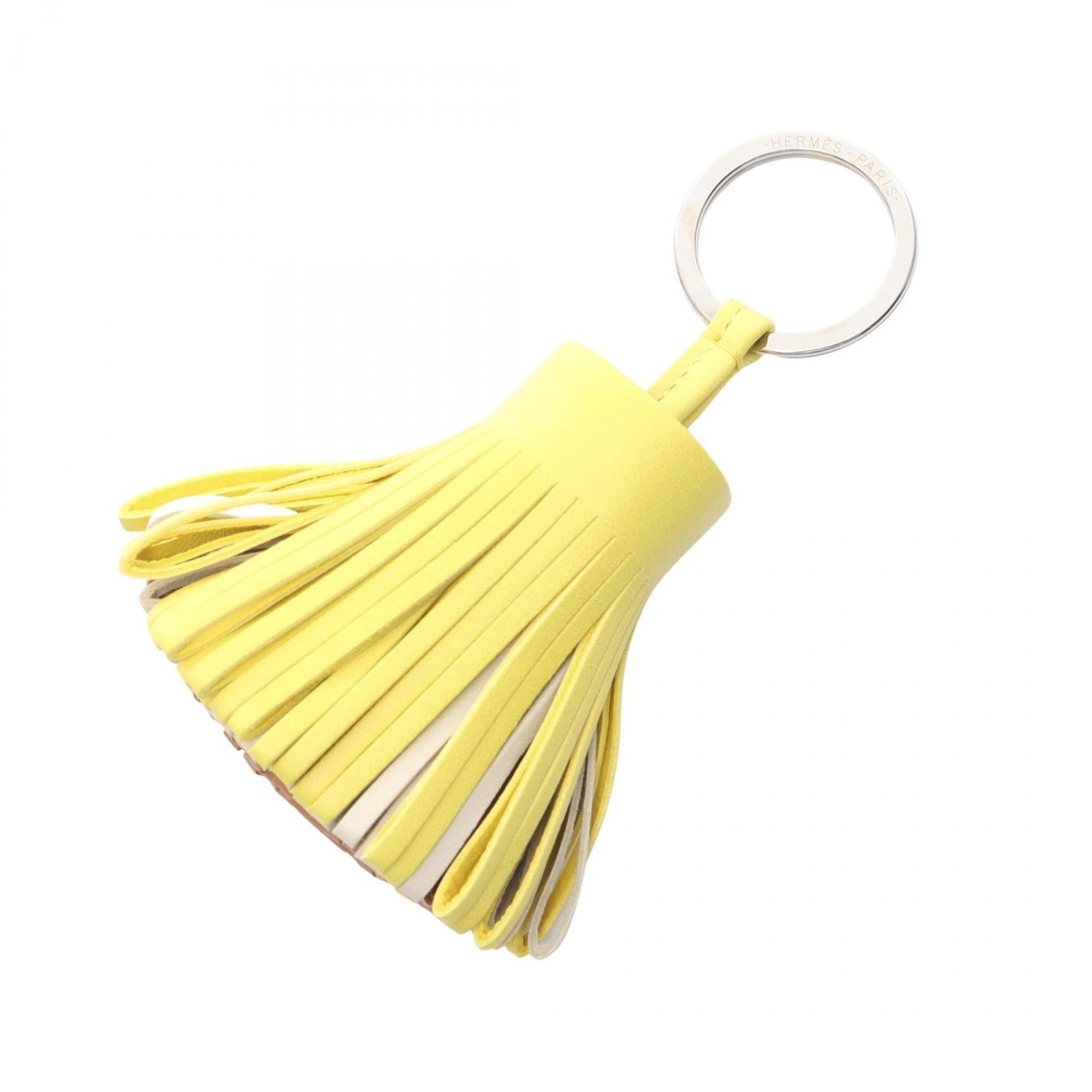 Agneau Handbag Charm Hermes: Agneau Handbag Charm Hermes Agneau Handbag Charm by Hermes bears a signature. Made from Agneau Milo, this charm features a distinctive brown and ivory color combination. The unique design showcases