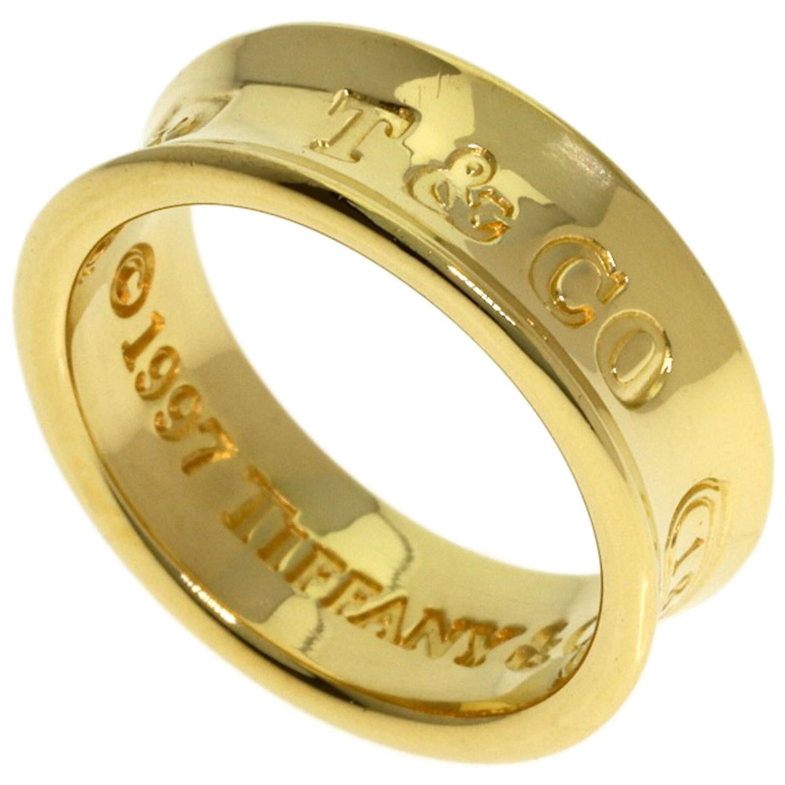 Tiffany Band Ring Yellow Gold (18K): Tiffany Band Ring Yellow Gold (18K) Yellow gold (18K) band ring with a classic design, suitable for women. This 18K yellow gold band ring features a simple yet elegant style that complements various o