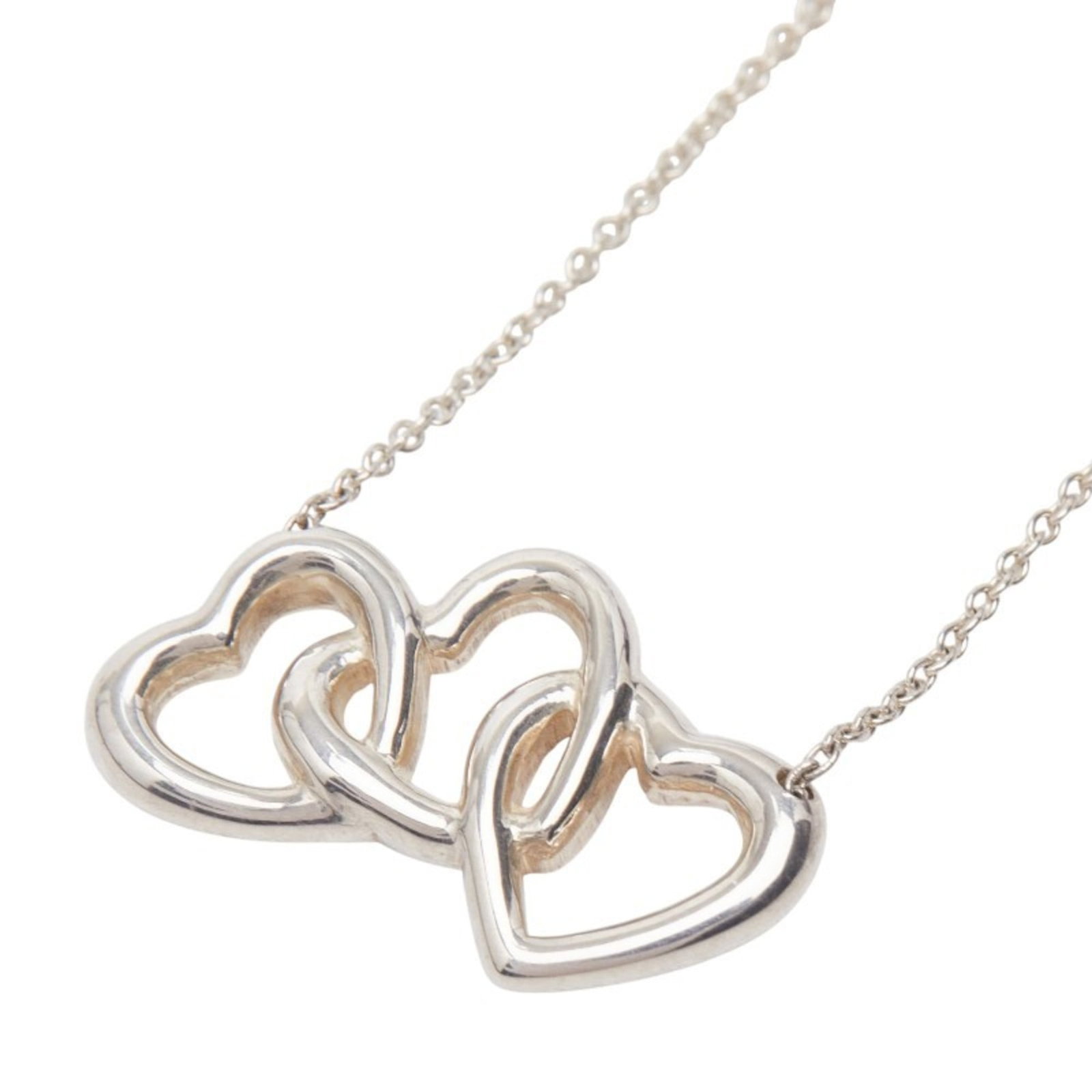 Triple Heart Necklace 925 Sterling Silver For Women by Tiffany & Co: Triple Heart Necklace 925 Sterling Silver For Women by Tiffany & Co Triple Heart Necklace by Tiffany & Co features a stunning 925 sterling silver design, showcasing intricate details and a classic sty