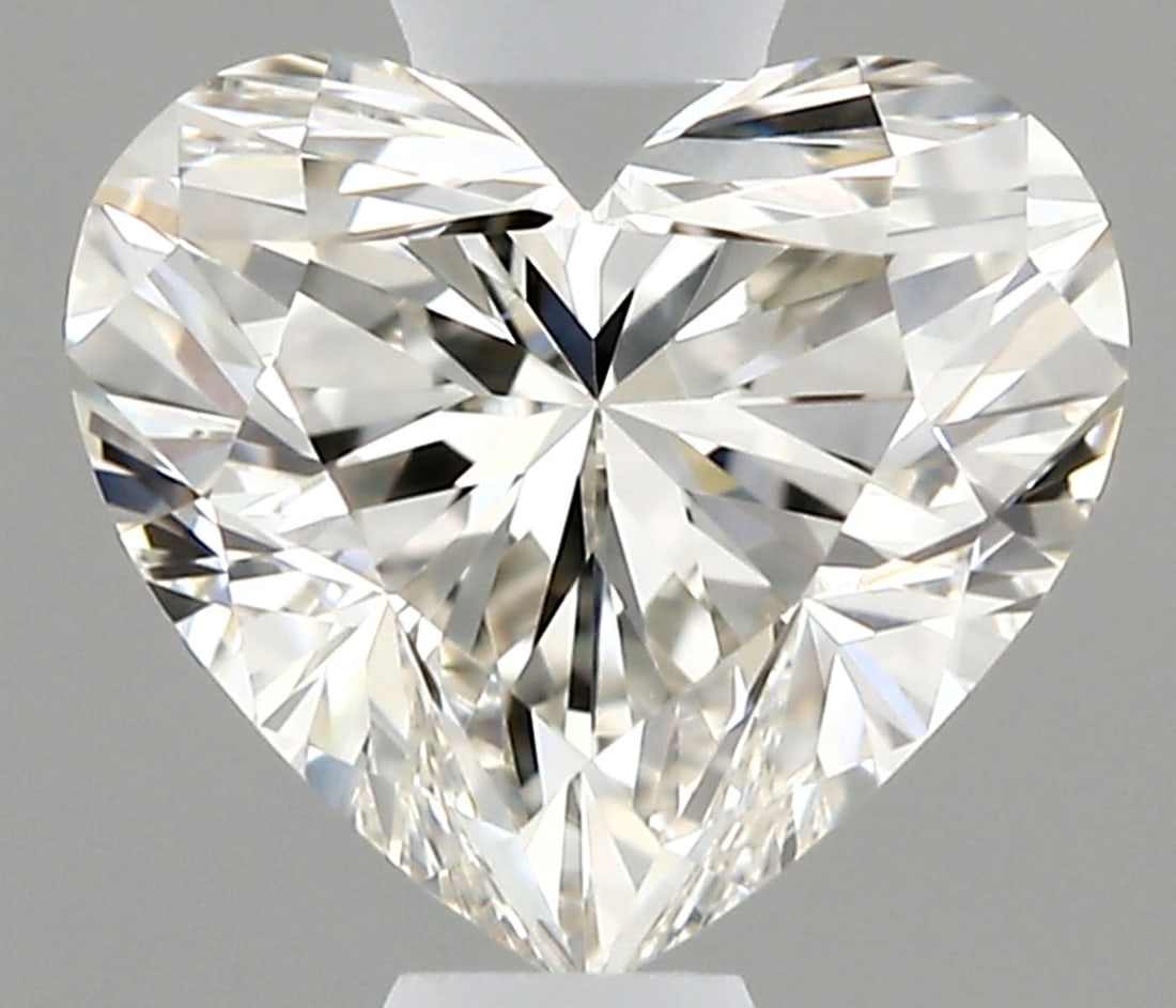 IGI Heart 0.7ct I VVS1 - Loose Natural Diamond: IGI Heart 0.7ct I VVS1 - Loose Natural Diamond 0.7ct IGI VVS1 Diamond - Natural BeautyThe IGI Heart diamond boasts exceptional clarity and polish, with an EX symmetry that showcases its precise cut. T