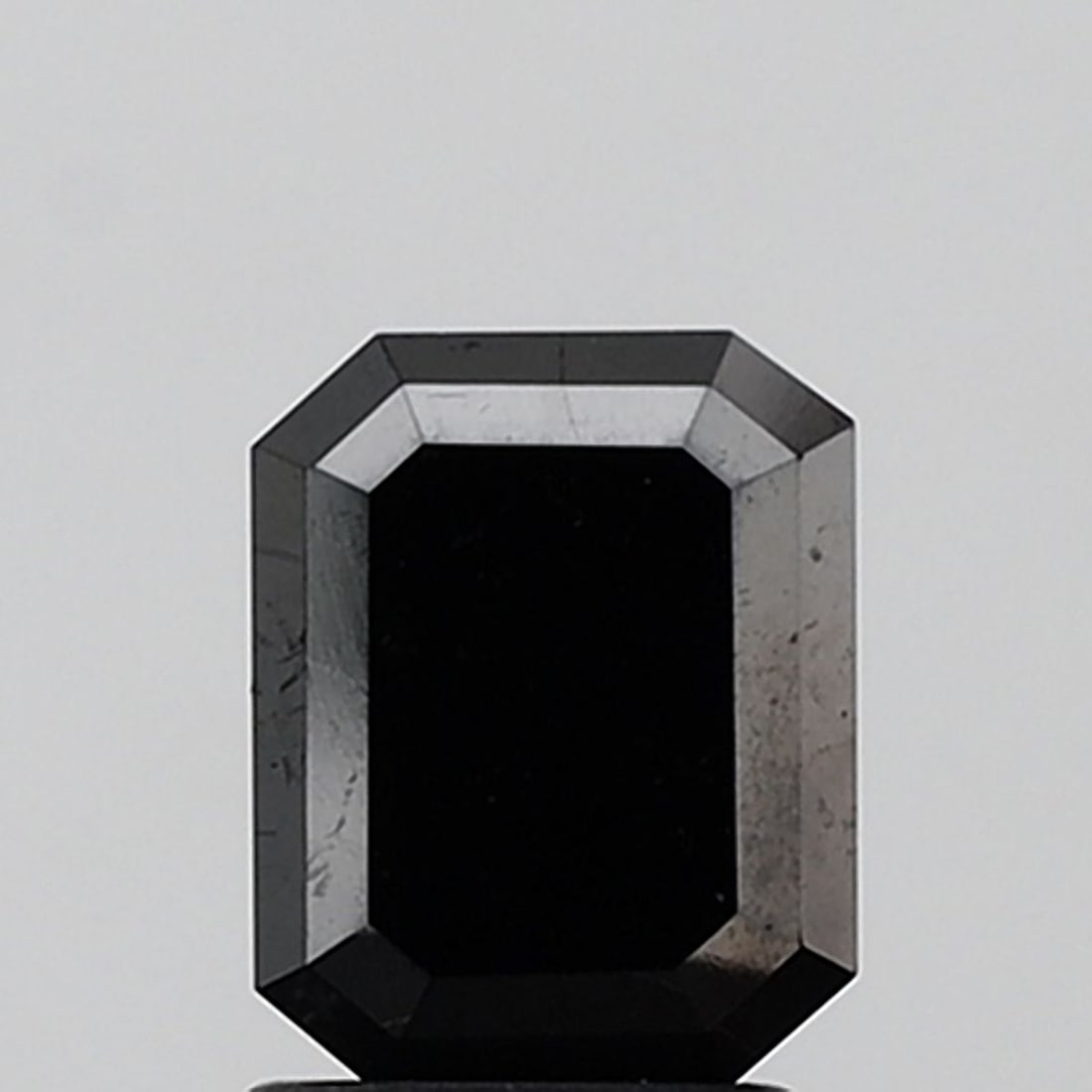 Emerald 1.99ct Fancy Black VVS2 - Loose Natural Diamond: Emerald 1.99ct Fancy Black VVS2 - Loose Natural Diamond 1.99ct Fancy Black VVS2 - Loose Natural Diamond with EX symmetry and EX polish, showcasing exceptional clarity and luster in its dark,