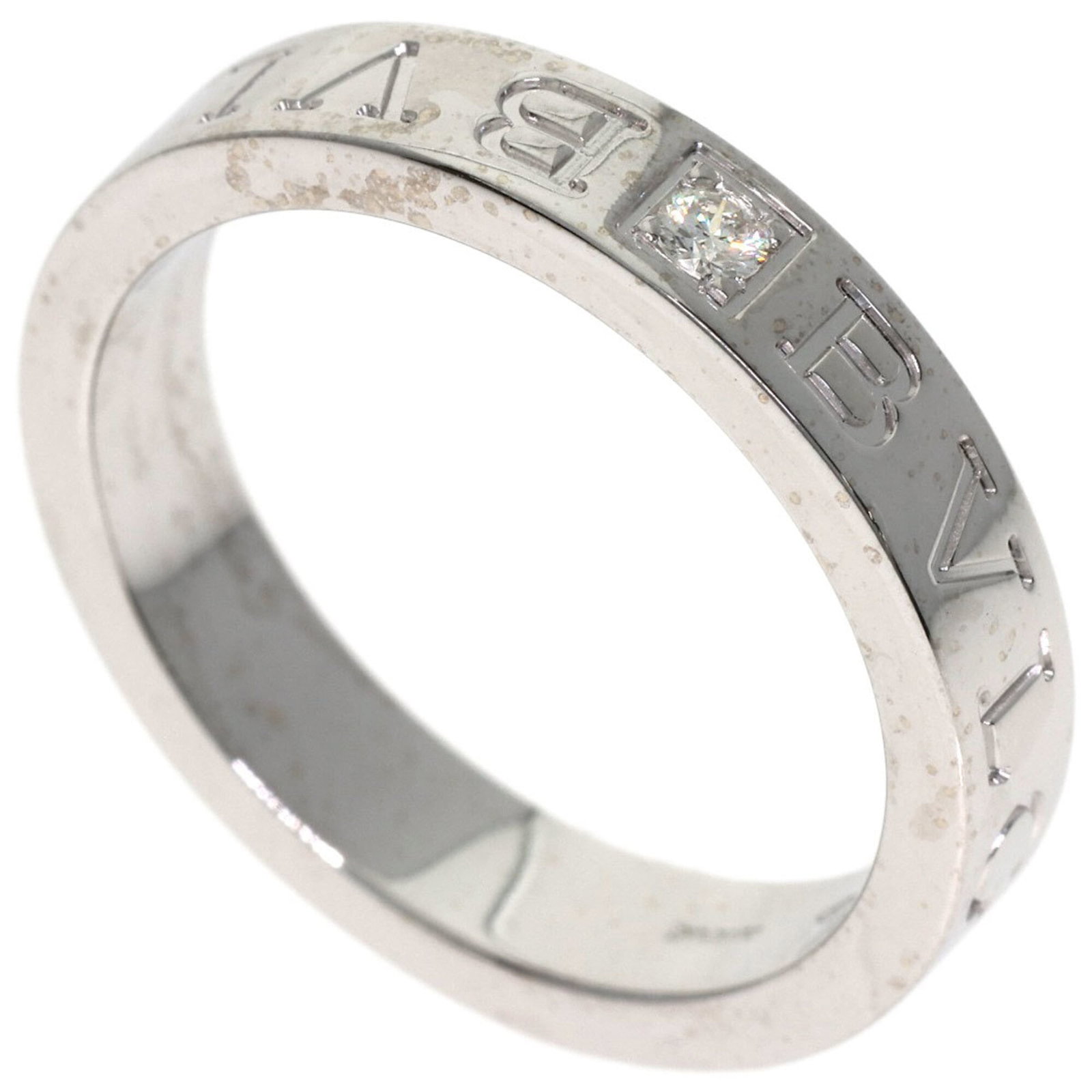 Bvlgari Band Ring White Gold (18K): Bvlgari Band Ring White Gold (18K) Bvlgari Band Ring White Gold (18K) features a diamond stone and is crafted from 18K white gold, making it a elegant accessory for women. The ring's US size is 7, pro