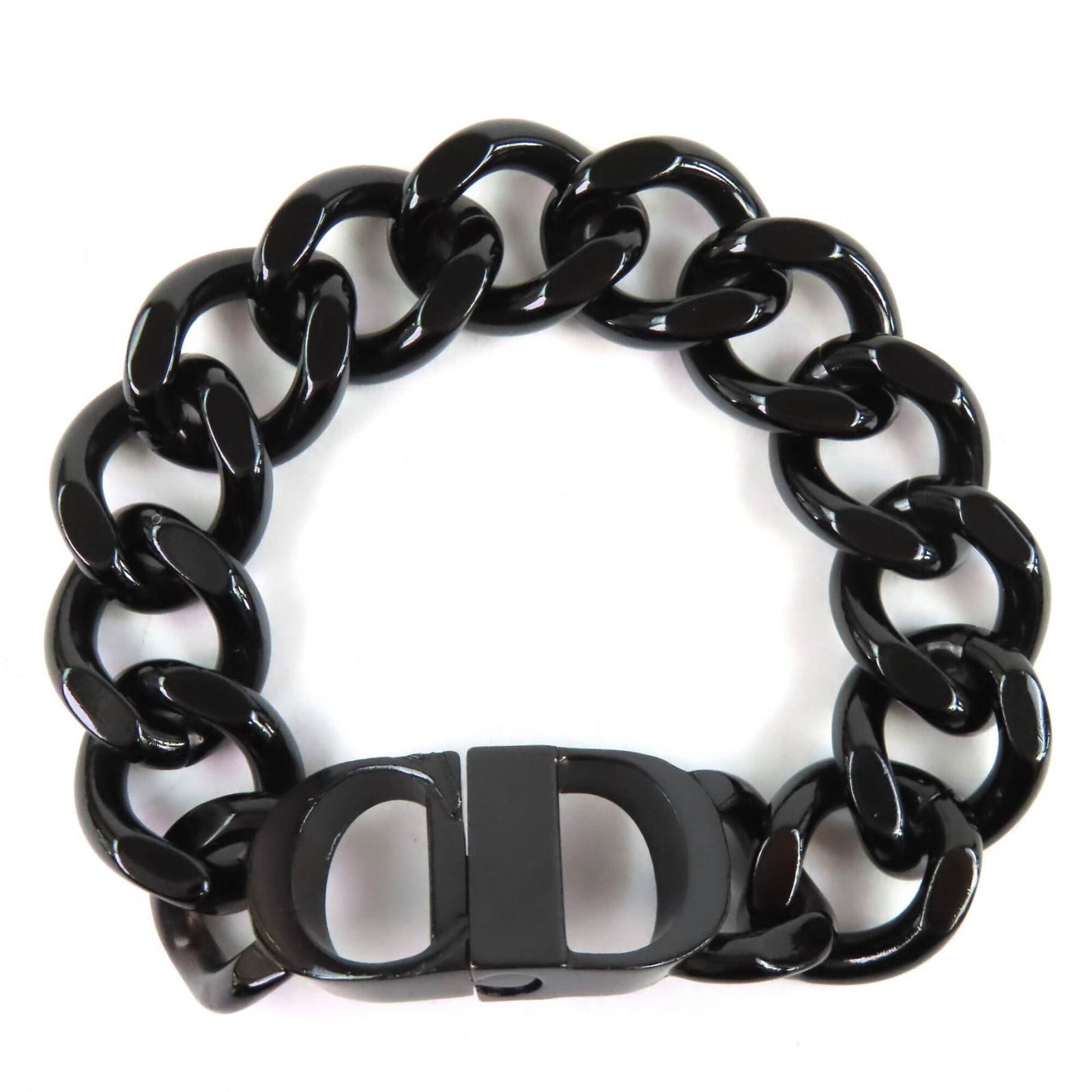 Christian Dior Charm Bracelet: Christian Dior Charm Bracelet Black charm bracelet from Christian Dior, measuring 19.5cm in length. This style features a sleek and sophisticated design, perfect for adding a touch of elegance to any 