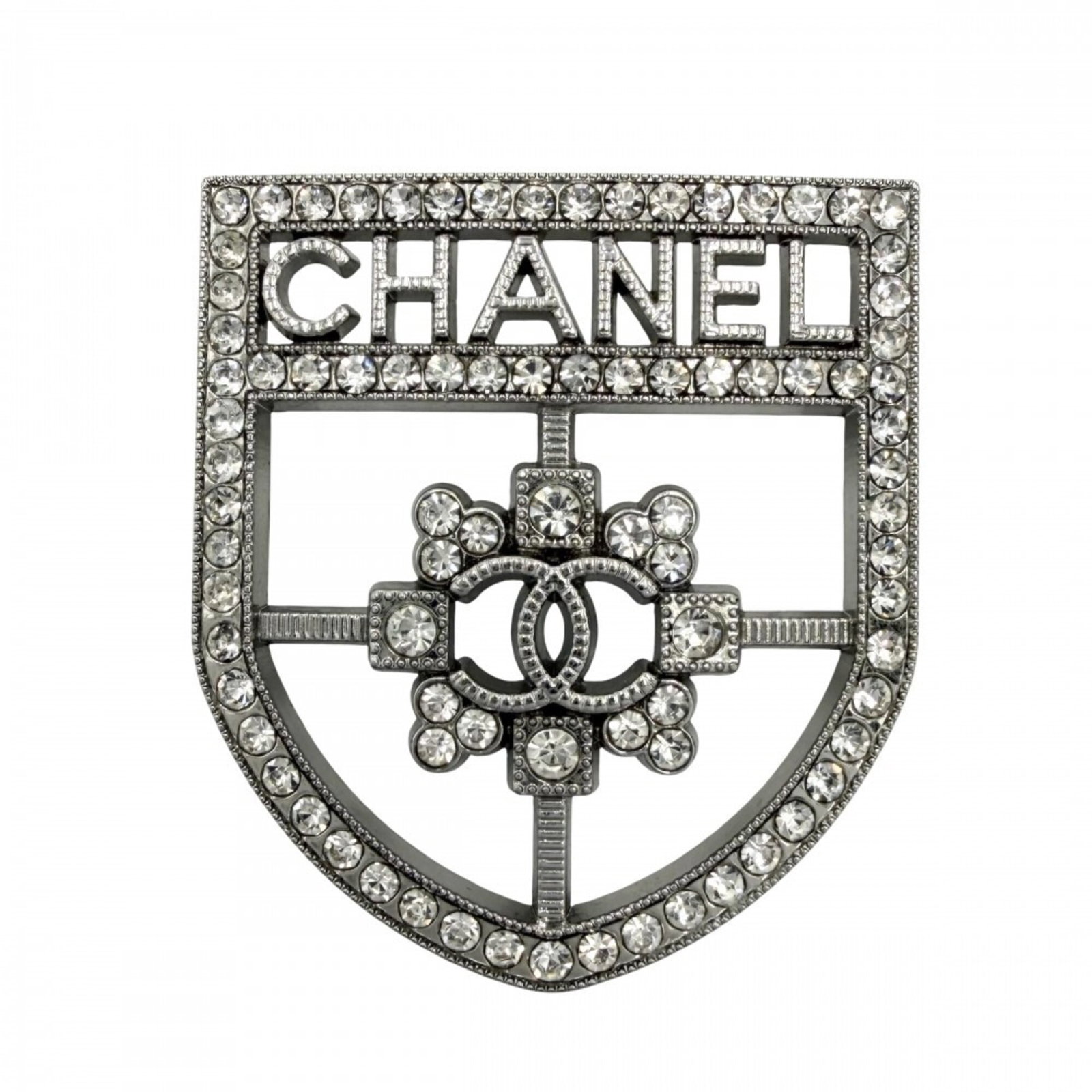 Rhinestone Chanel Brooch: Rhinestone Chanel Brooch Rhinestone Chanel Brooch stands out with its striking silver rhinestones and sleek design. Measuring 4.5cm x 4cm x 2.00mm, it adds a touch of glamour to any outfit. Its